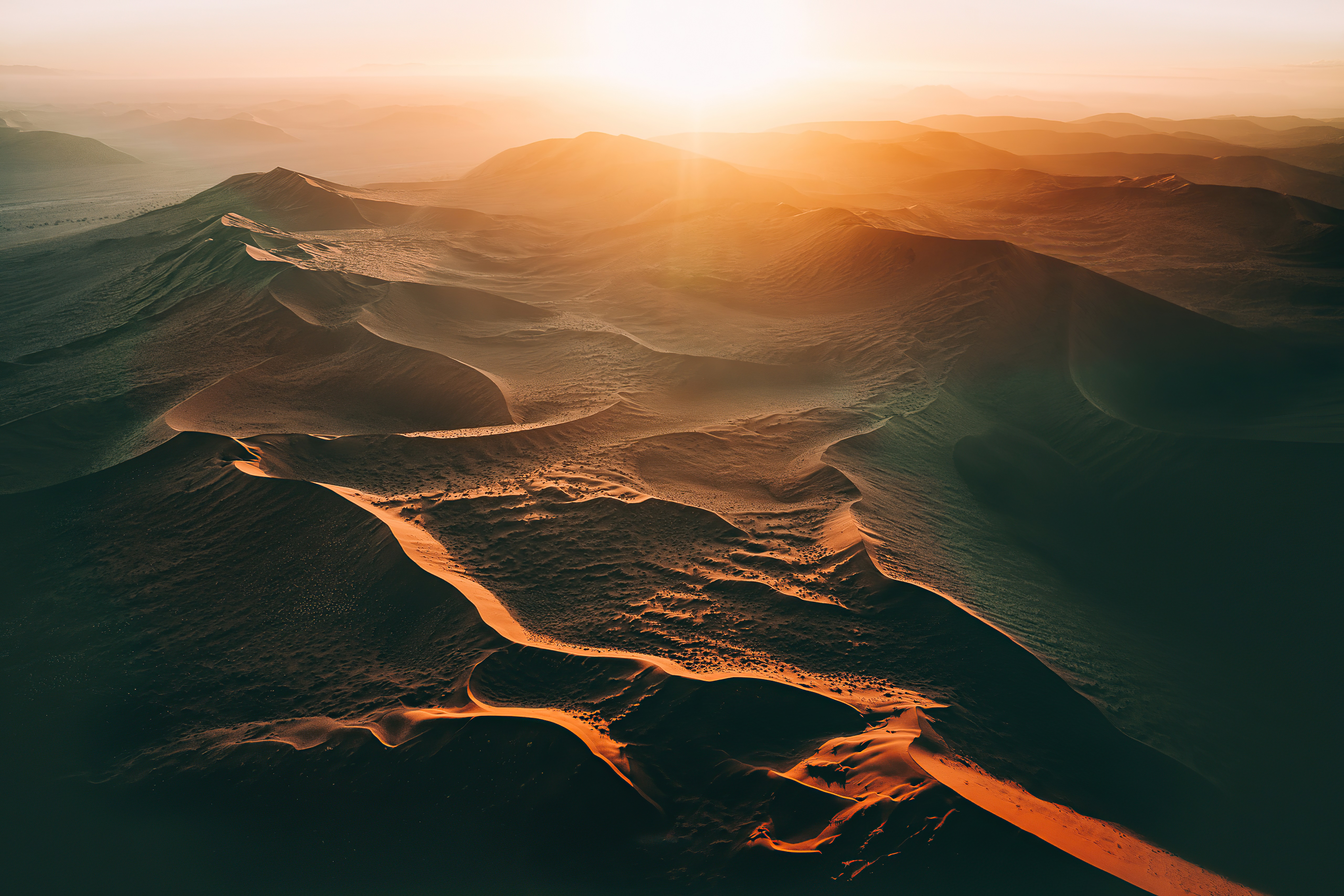 Aerial view of desert dunes at sunset HD Wallpaper