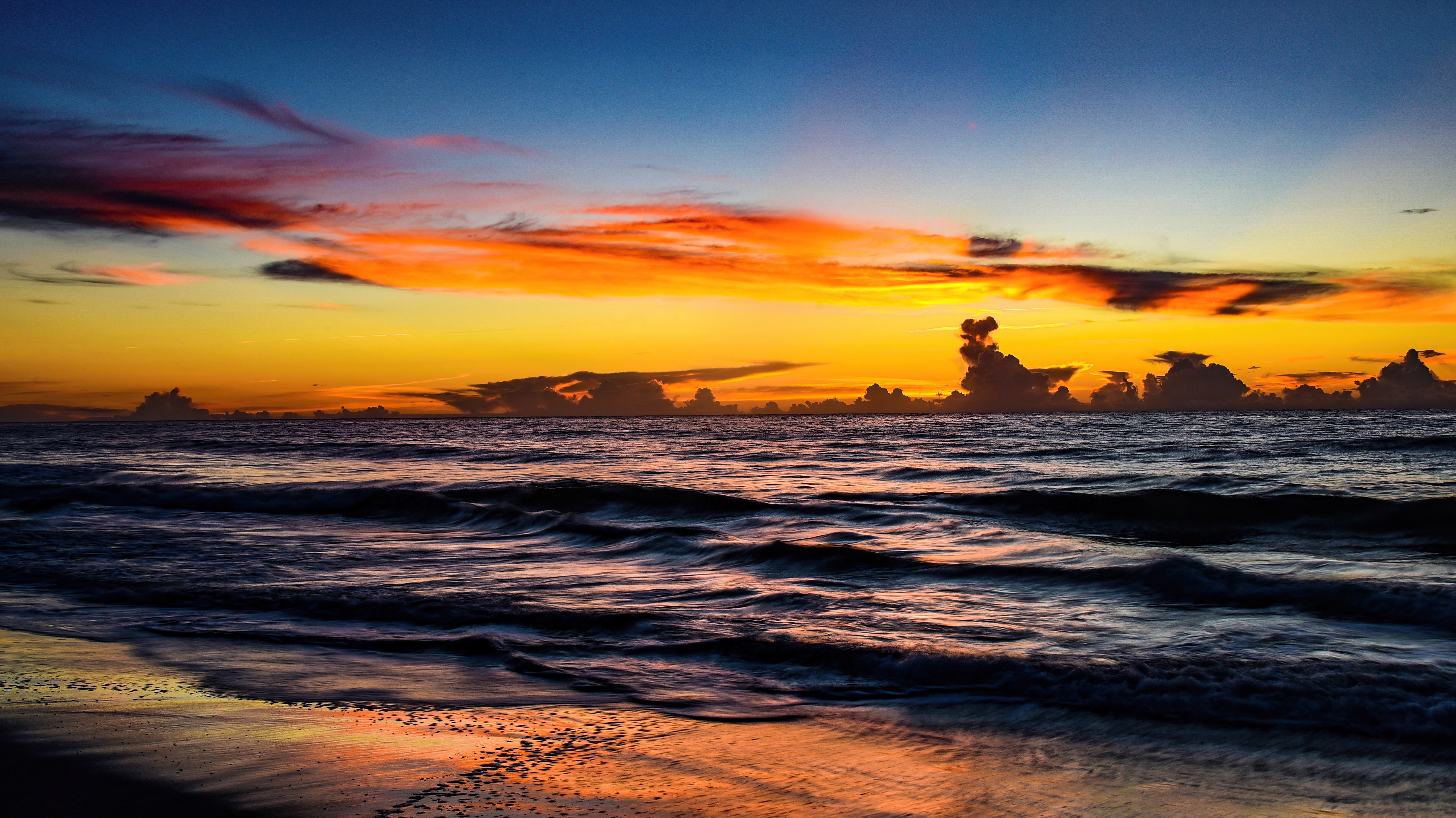 Ocean sunset with colorful clouds and waves HD Wallpaper