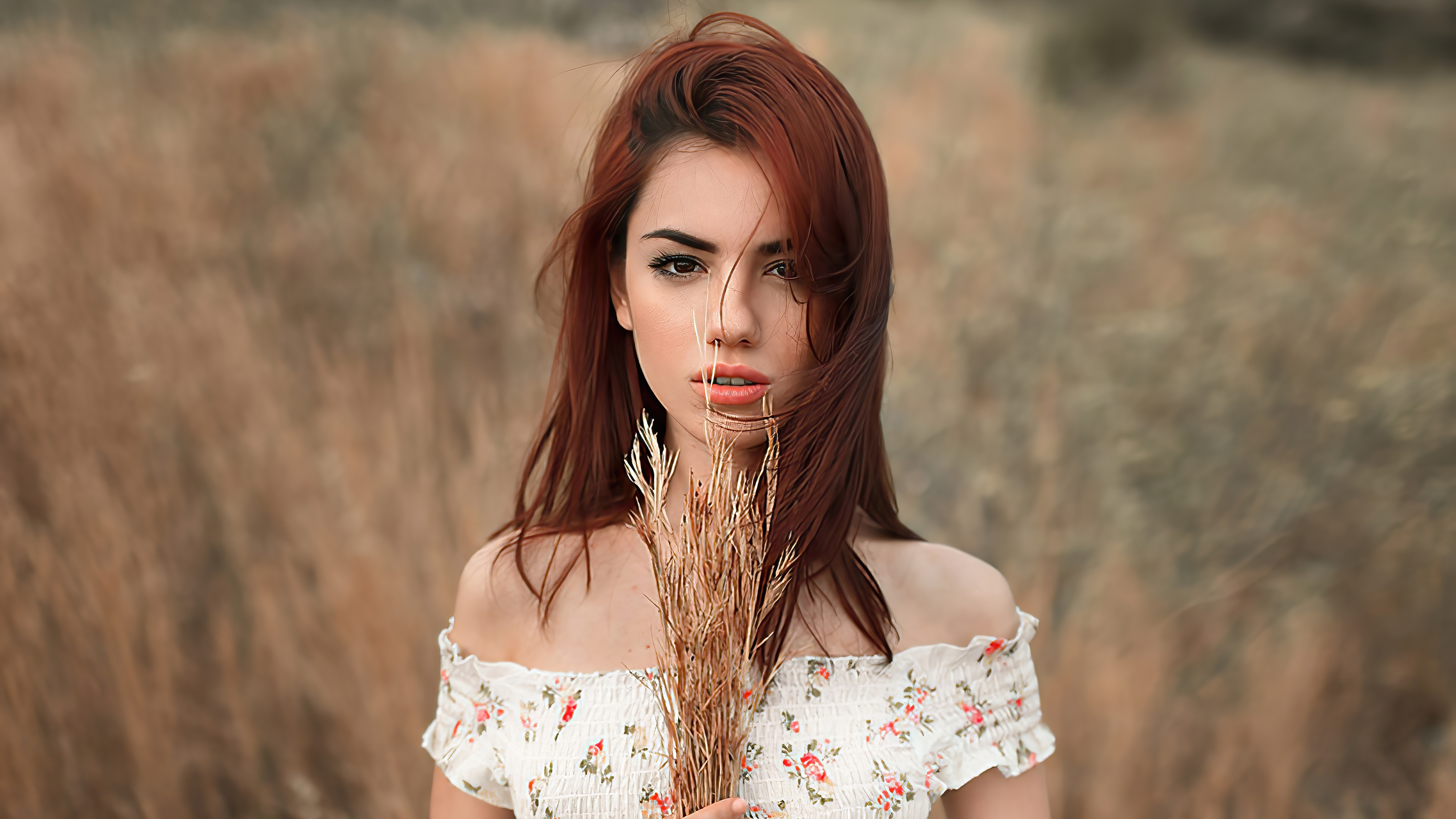 Model with red hair in a field HD Wallpaper