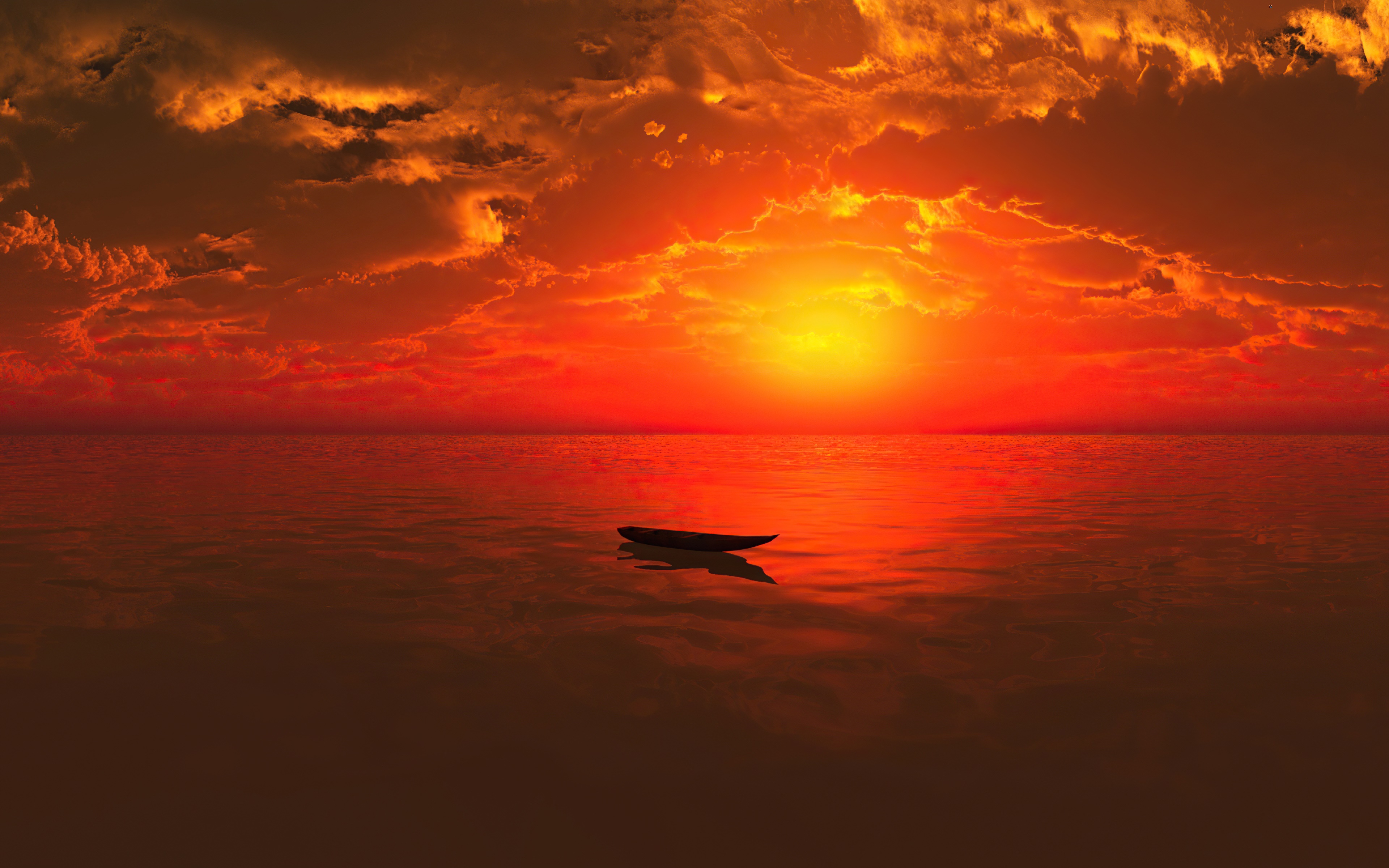 Boat on the ocean during a vibrant sunset 4K HD Wallpaper