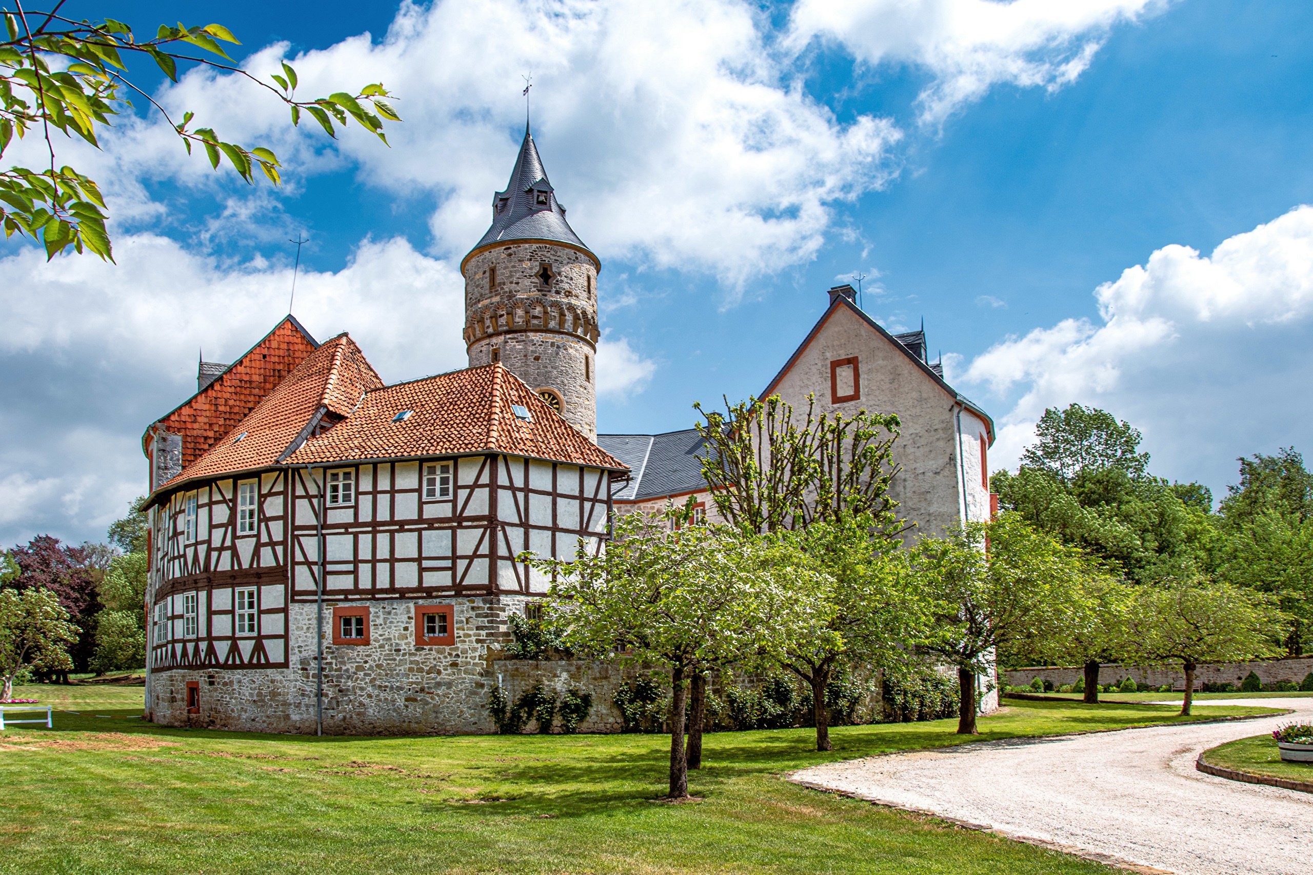 Half-timbered building and tower of a castle in Germany HD Wallpaper