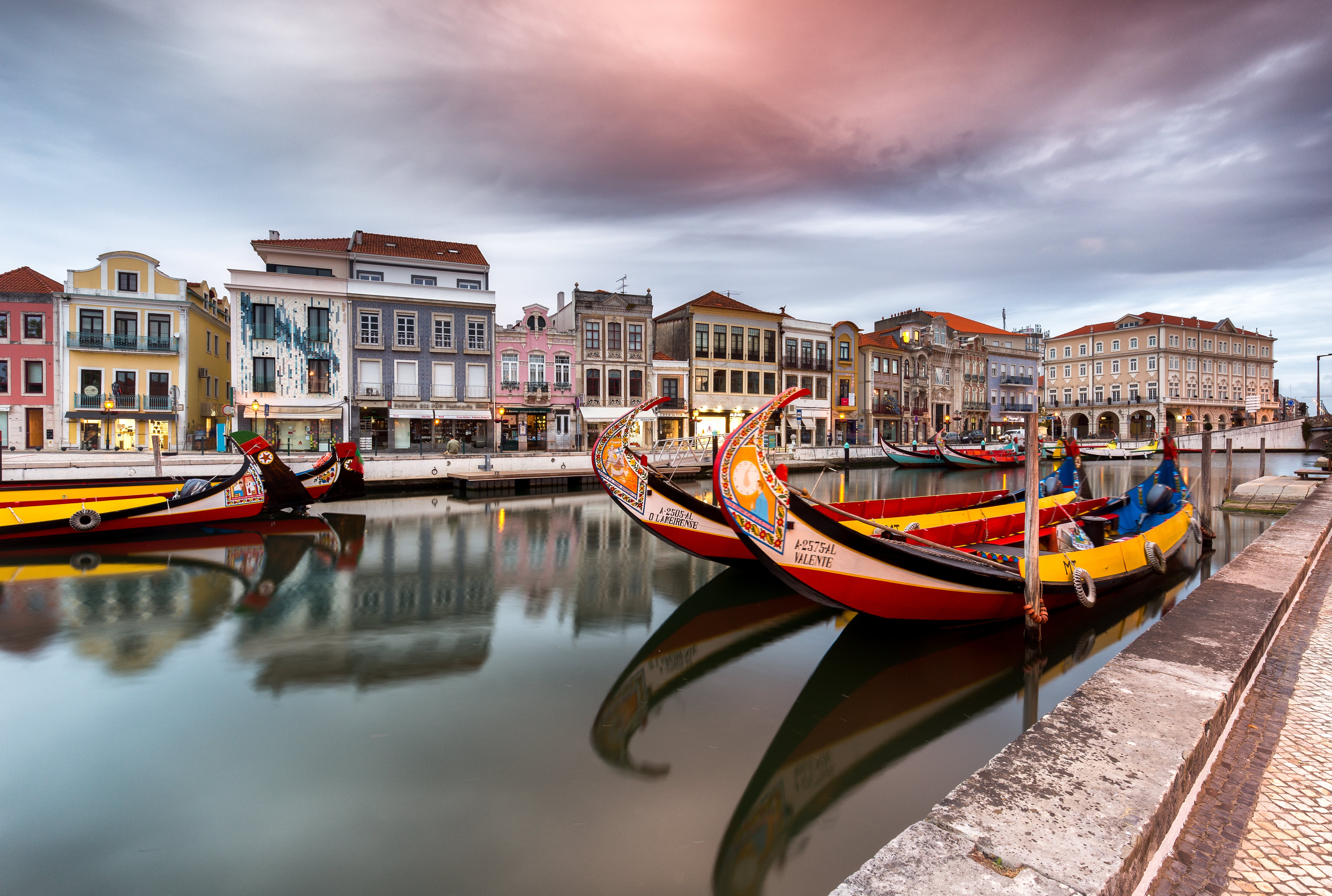Moliceiro boats on a canal in Aveiro, Portugal HD Wallpaper
