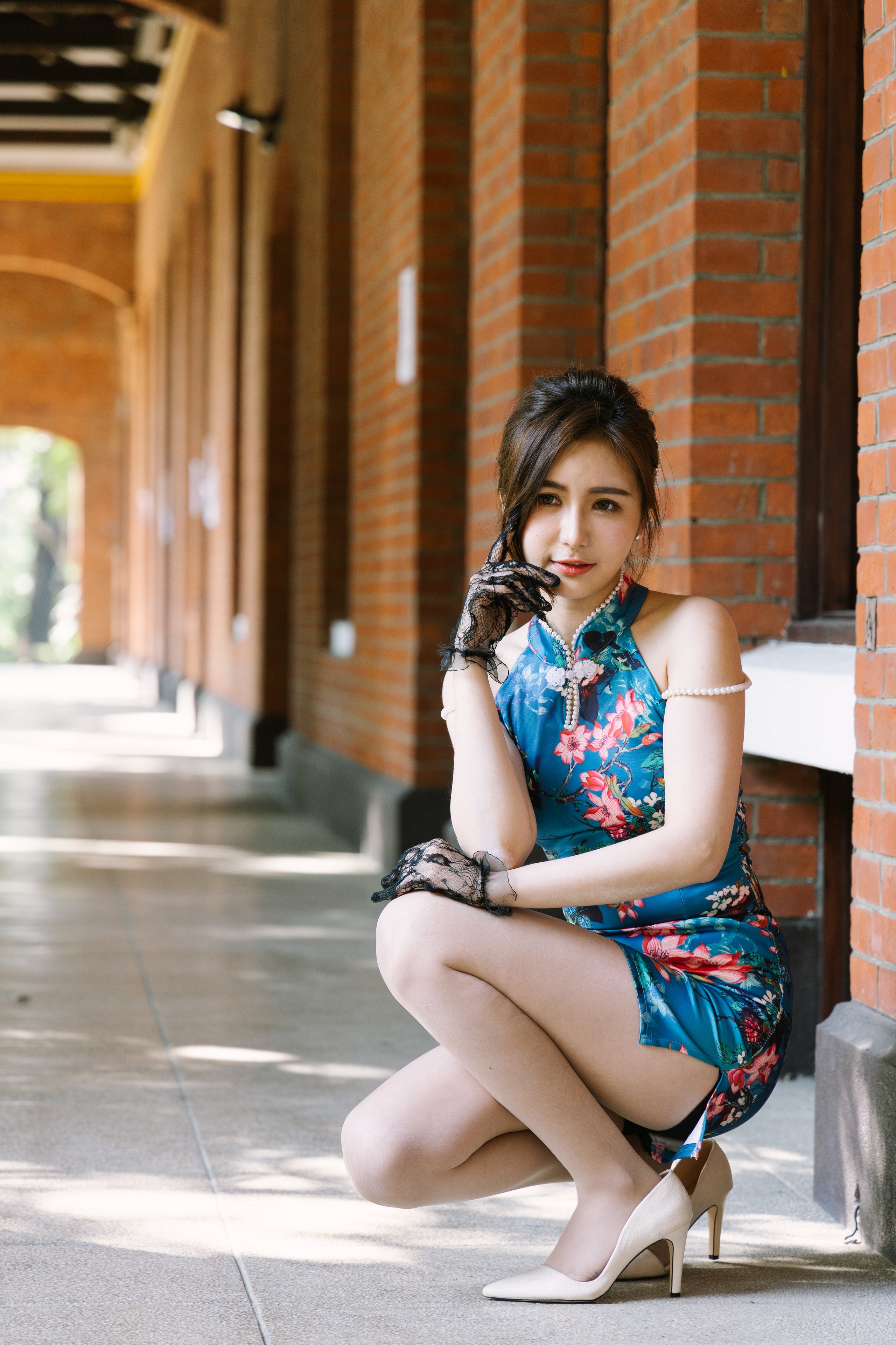 Woman in a floral dress posing outdoors HD Phone Wallpaper