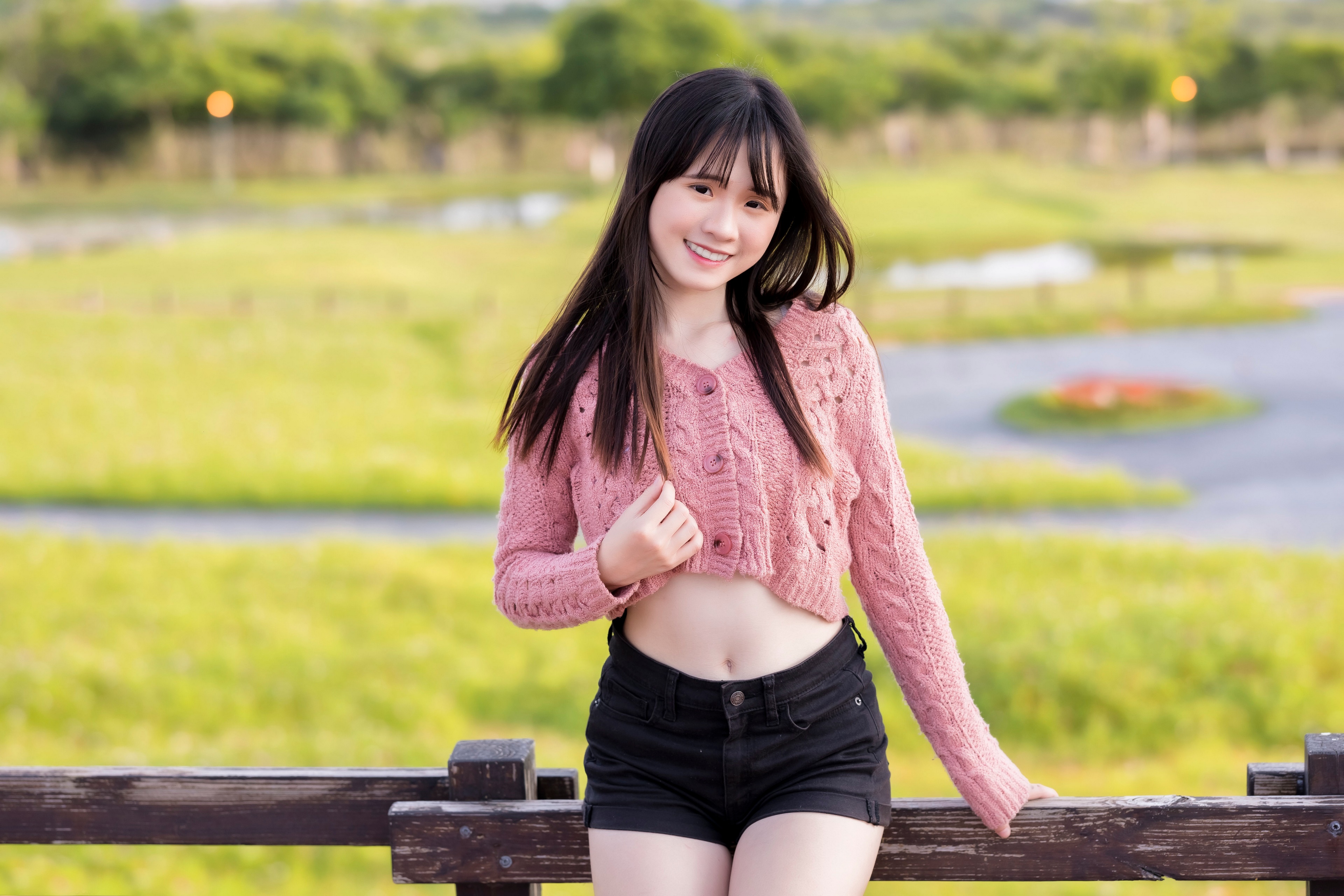 Asian girl in pink cardigan and black shorts HD Wallpaper