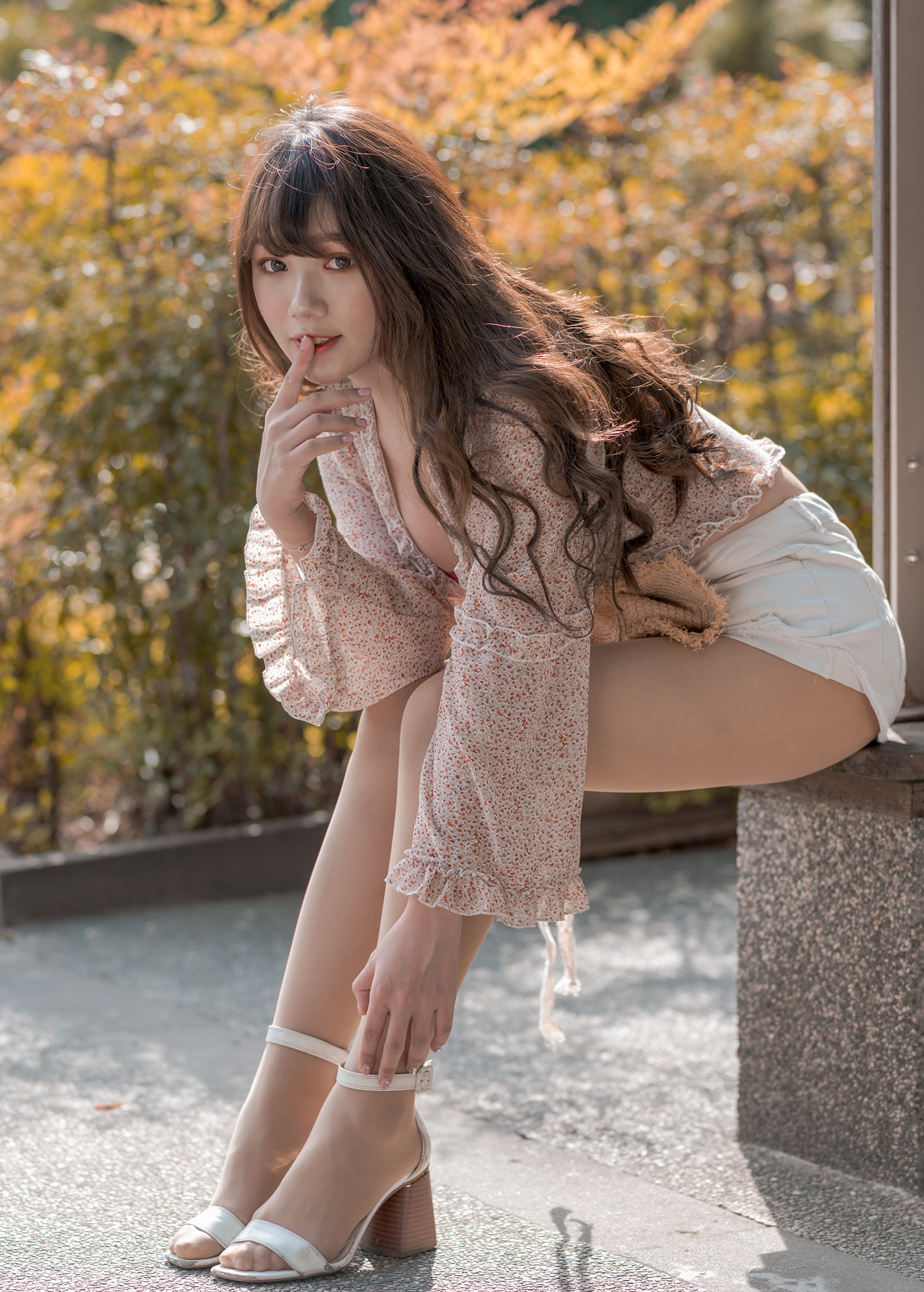 Asian woman with brown hair wearing shorts and a floral top HD Phone Wallpaper
