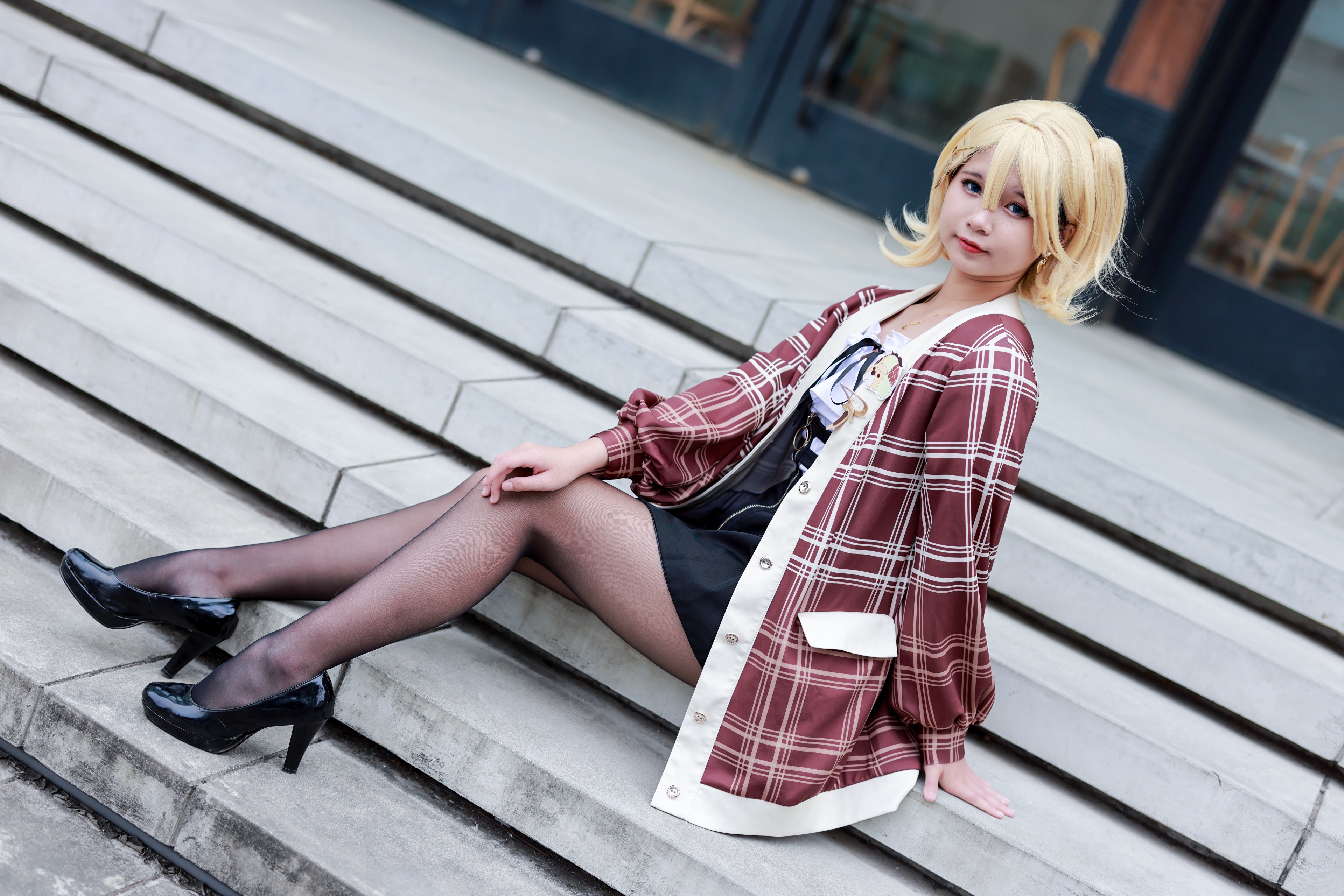 Blonde girl in plaid cardigan sitting on stairs HD Wallpaper