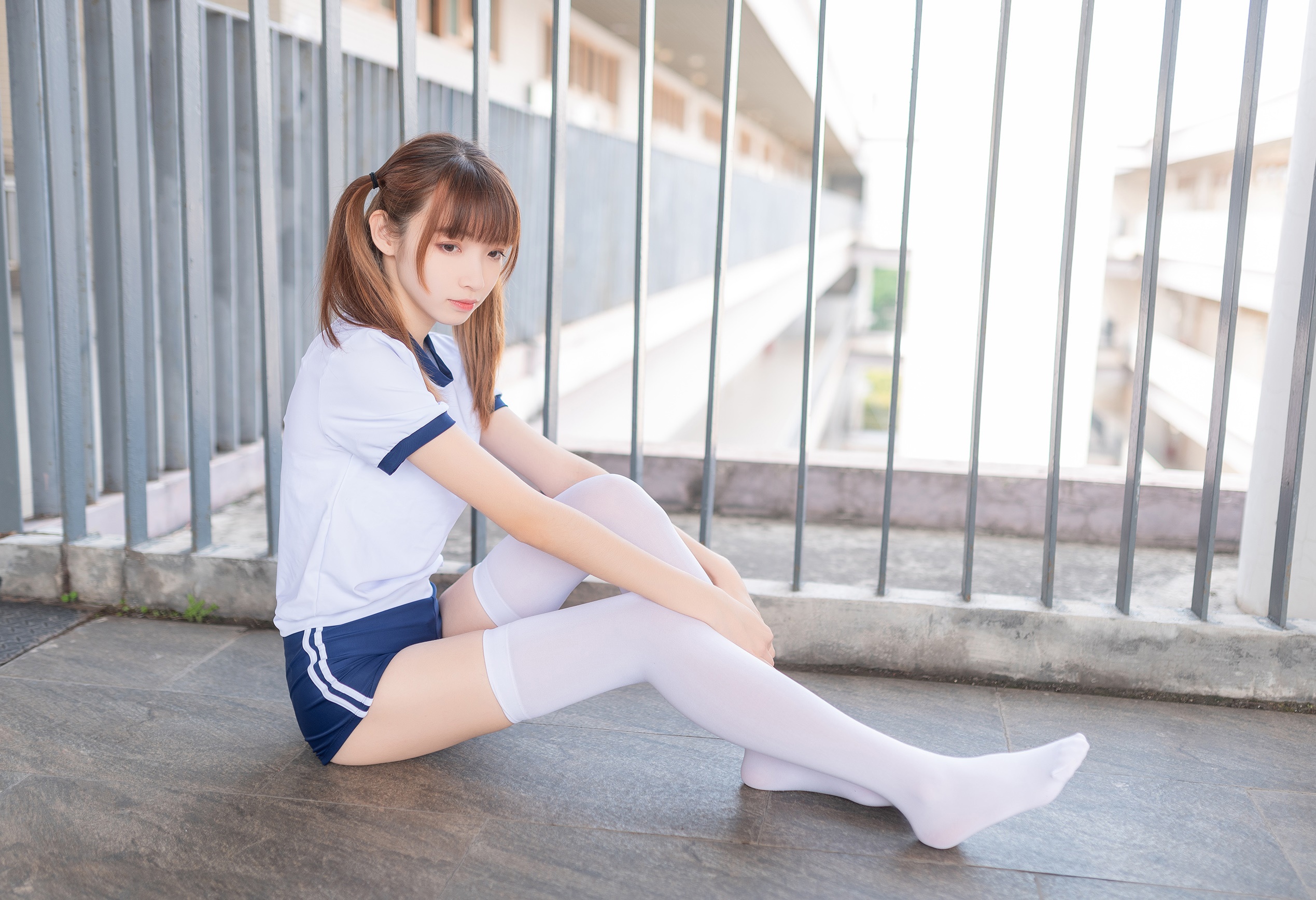 Asian girl in school uniform sitting on the ground HD Wallpaper