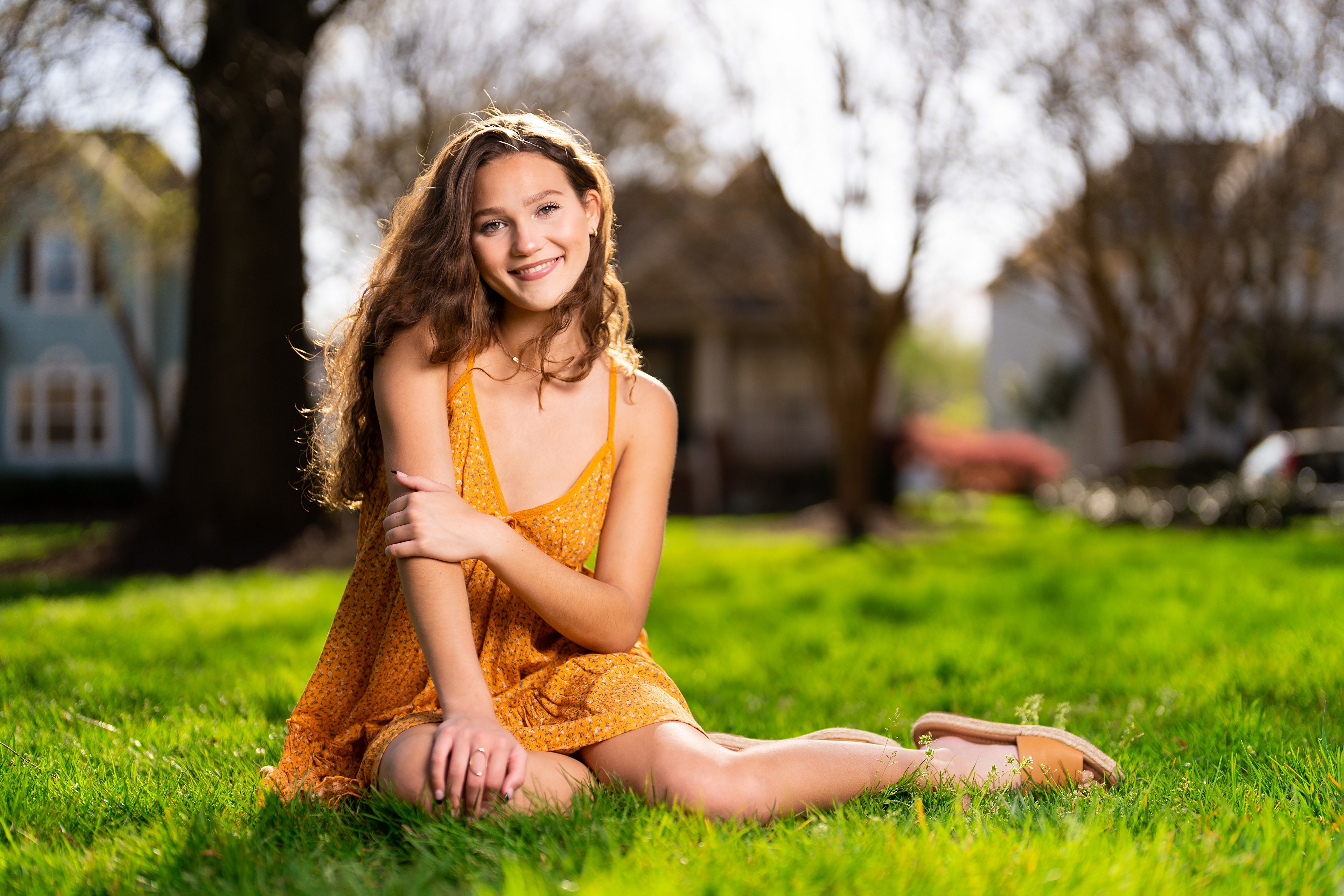 Girl in yellow dress sitting on grass HD Wallpaper