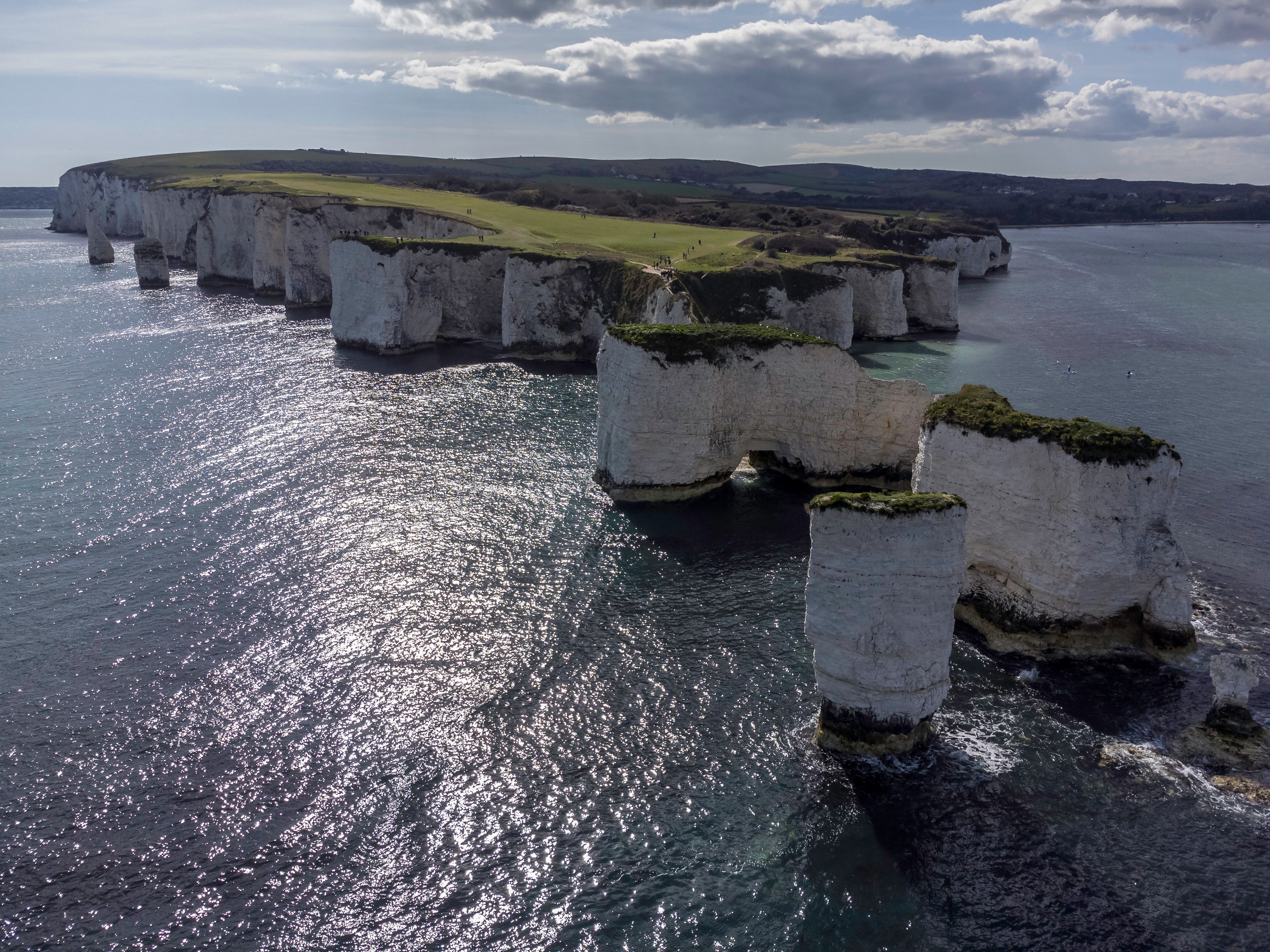 4K aerial view of Dorset England coast cliffs HD Wallpaper