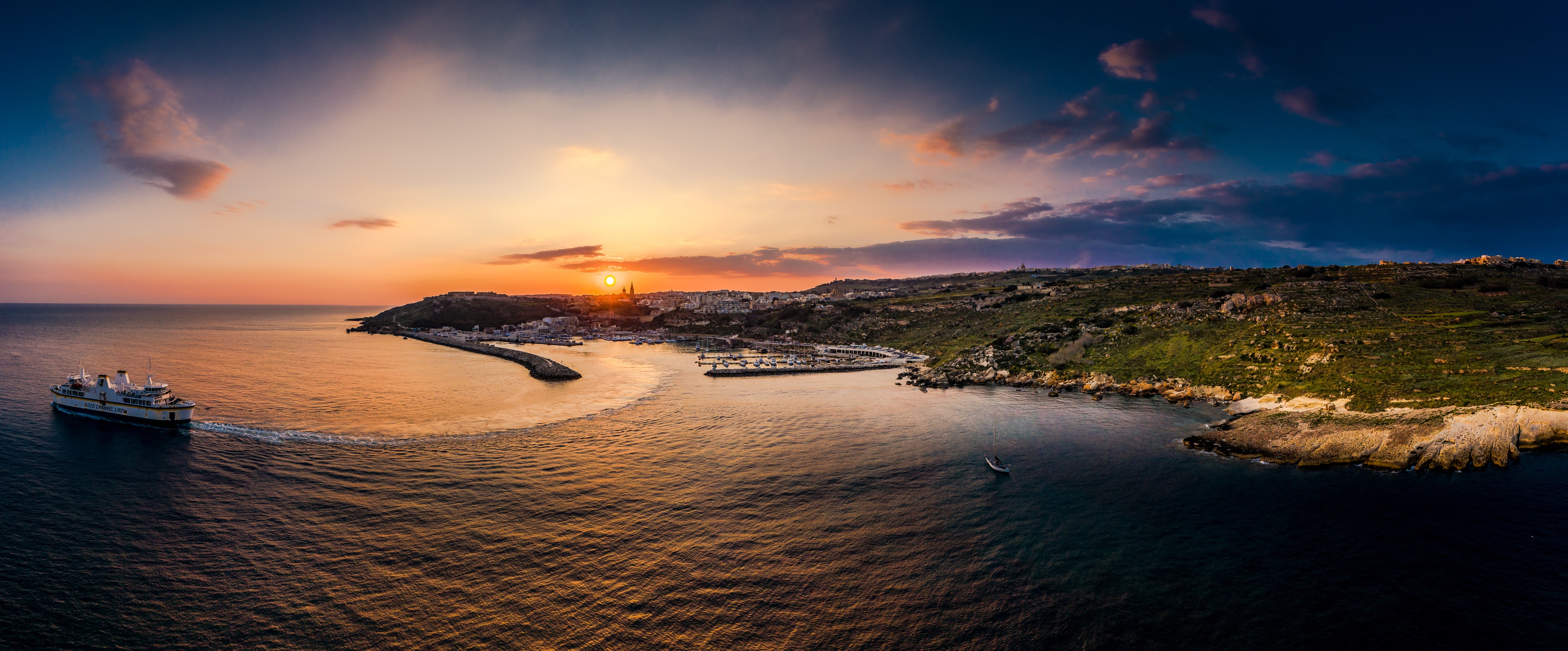 Ferry sailing near Gozo, Malta at sunset HD Wallpaper