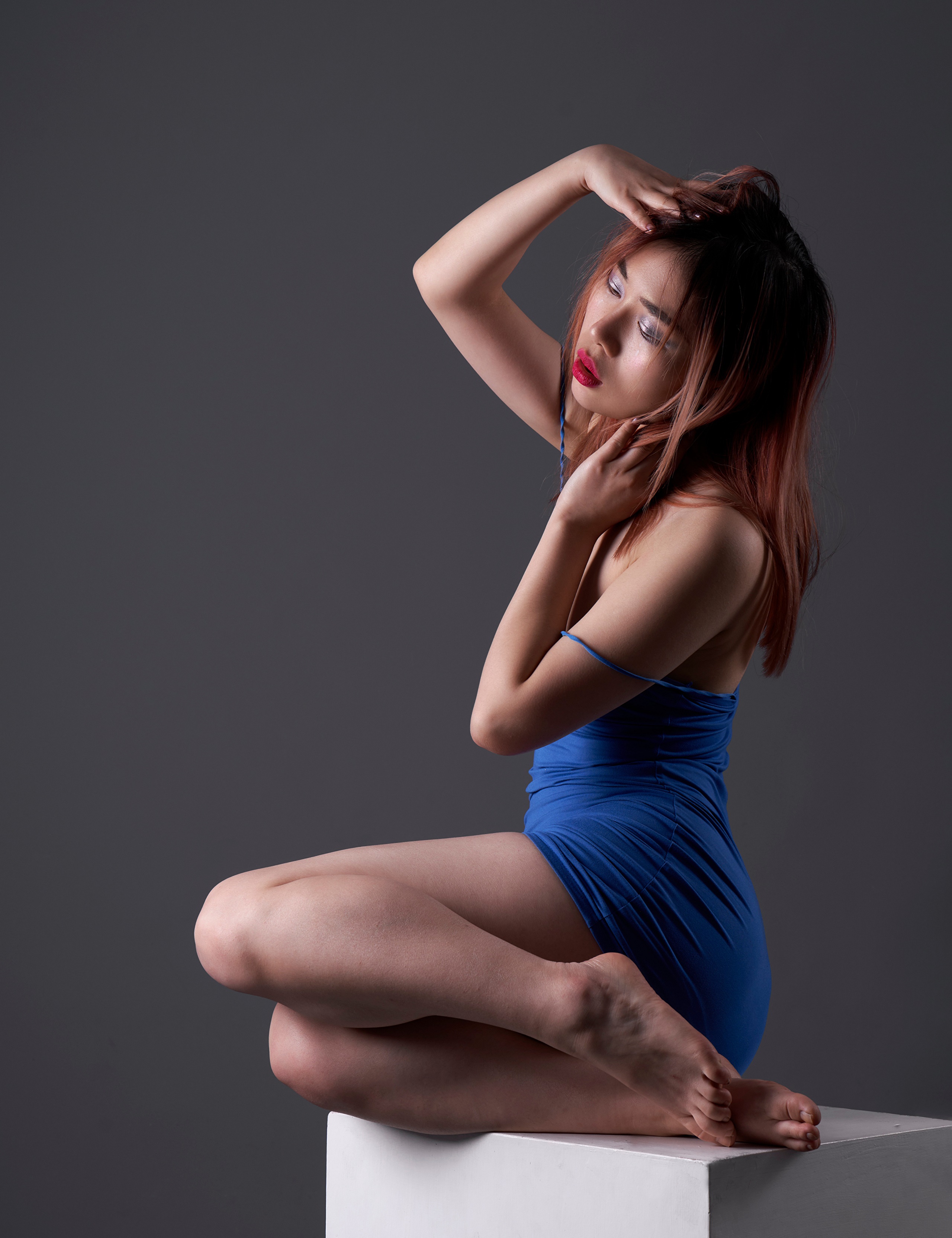 Asian woman in blue dress posing on cube HD Phone Wallpaper