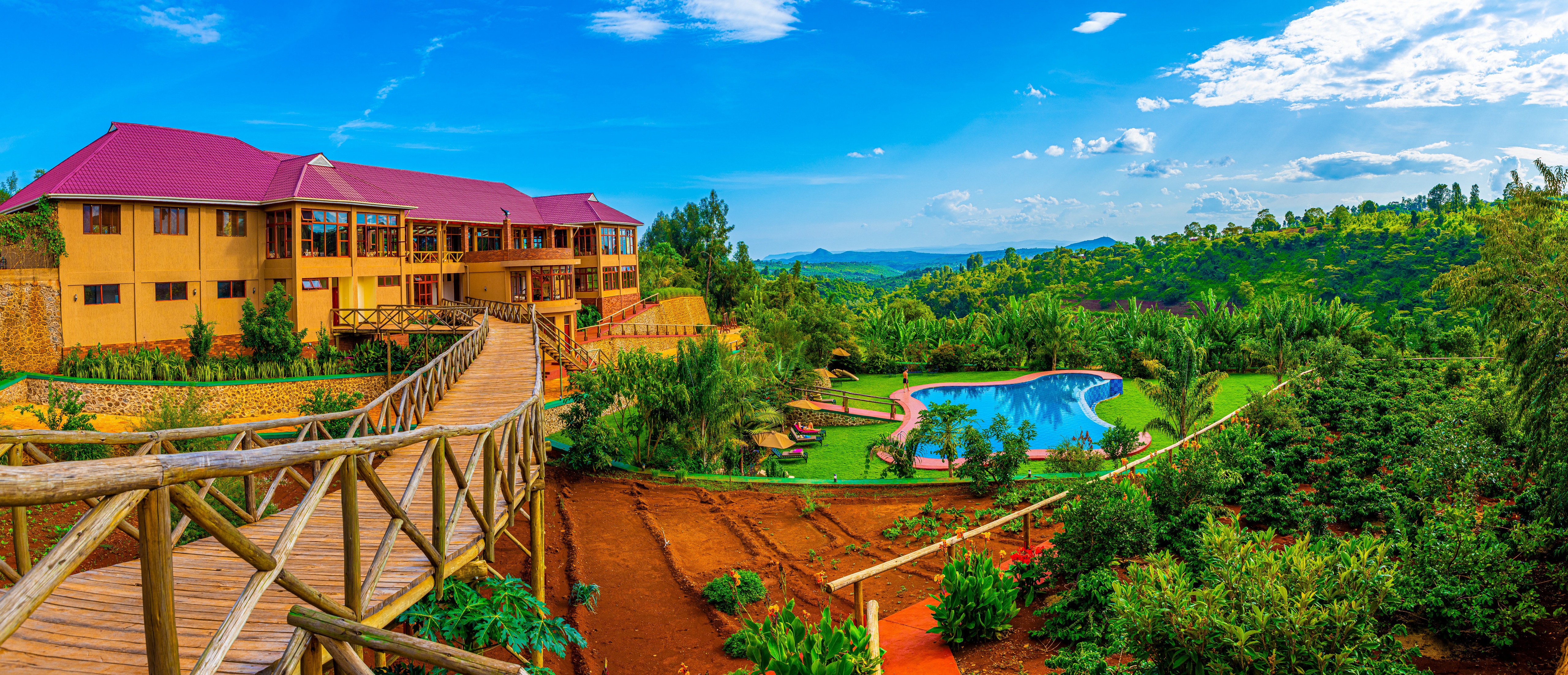 Hotel with pool and wooden bridge in Karatu, Tanzania HD Wallpaper