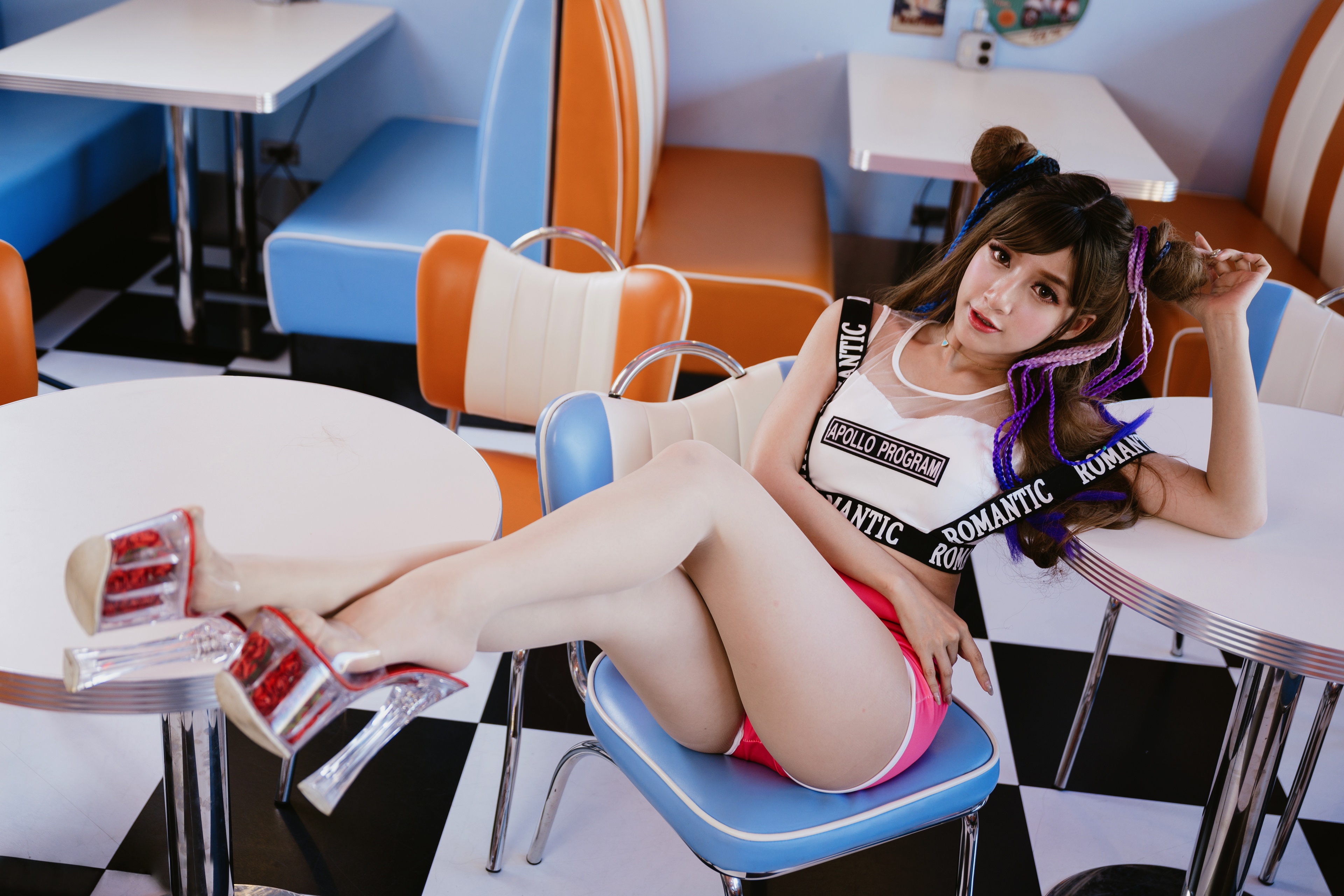 Asian woman in retro diner setting HD Wallpaper
