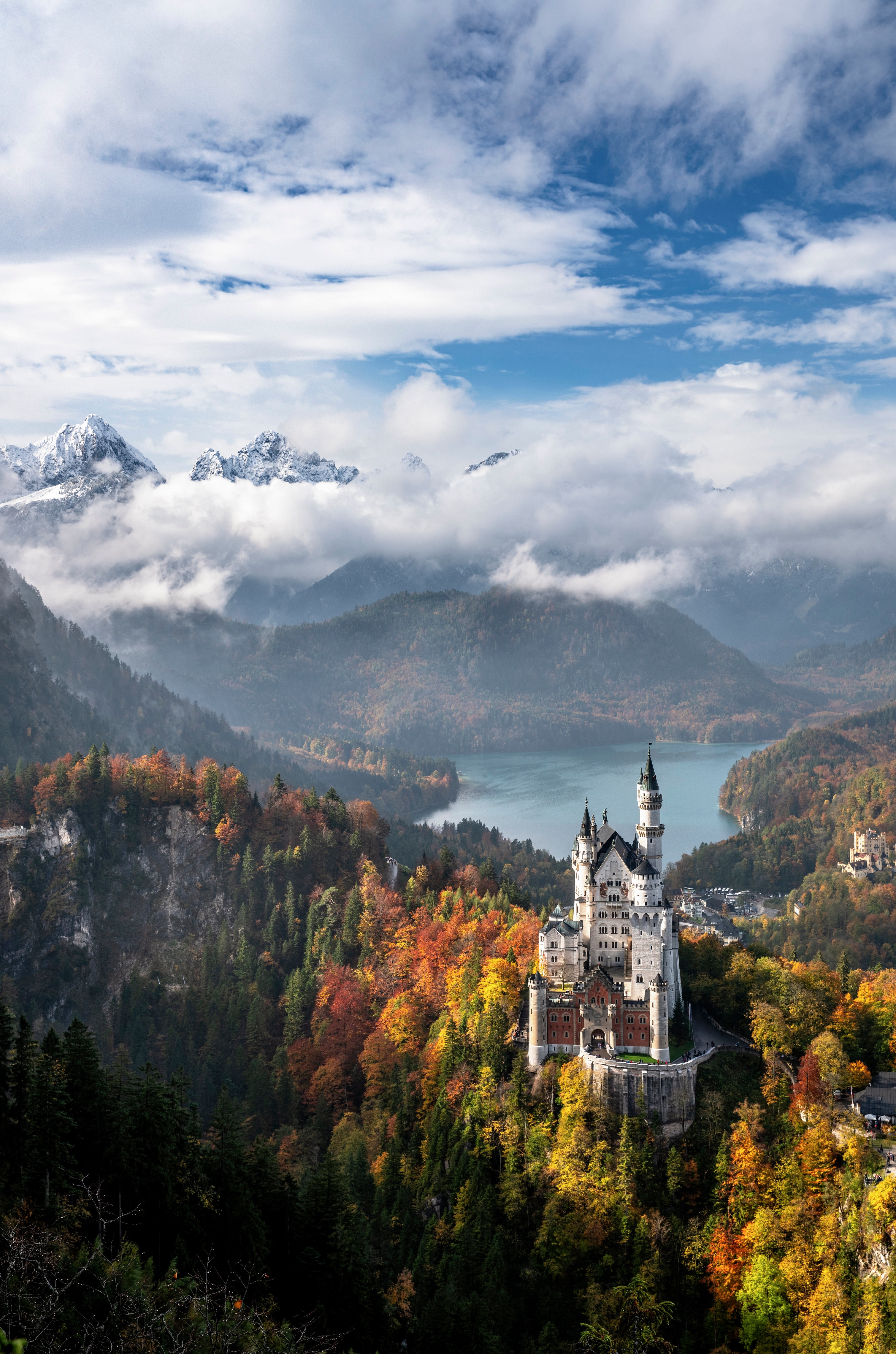 Neuschwanstein Castle in the Bavarian Alps during autumn HD Phone Wallpaper
