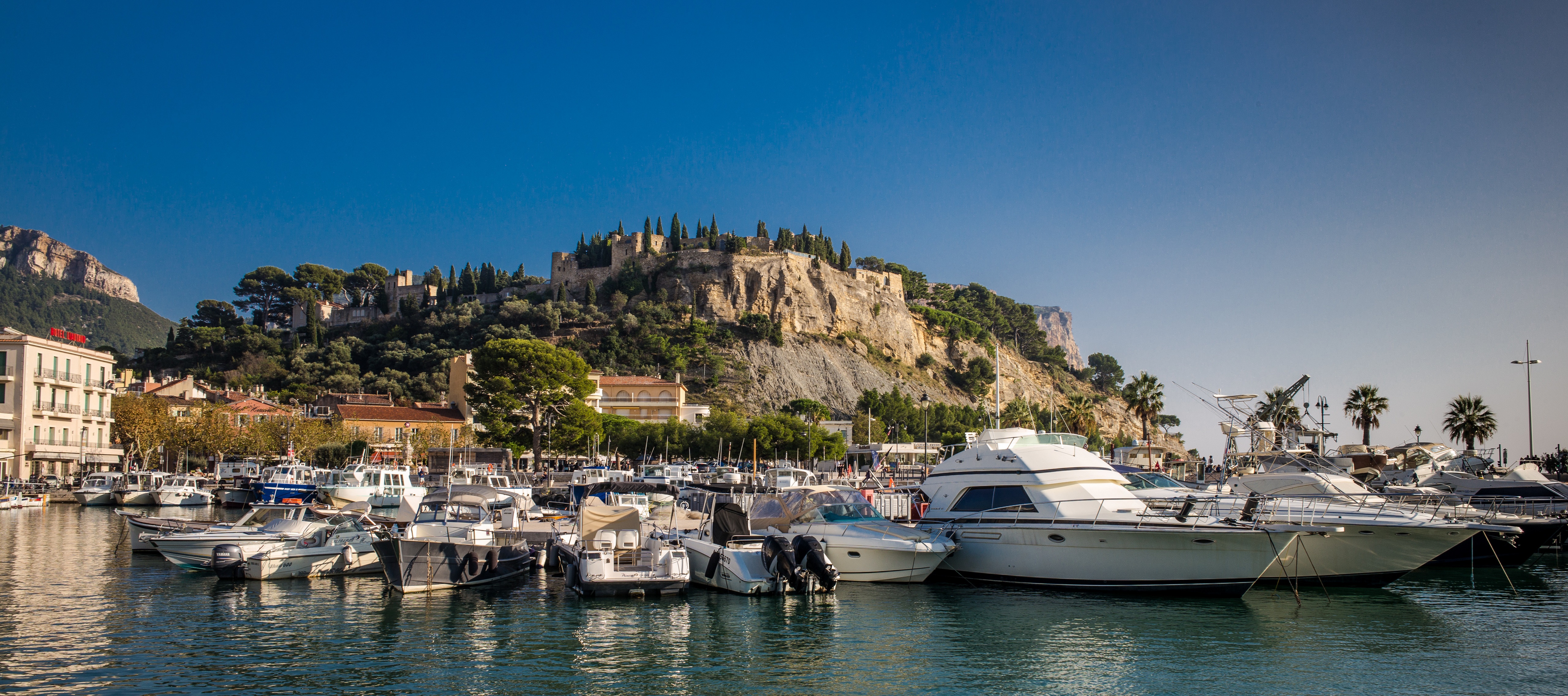 Boats in Cassis Marina with Castle on Cliff HD Wallpaper