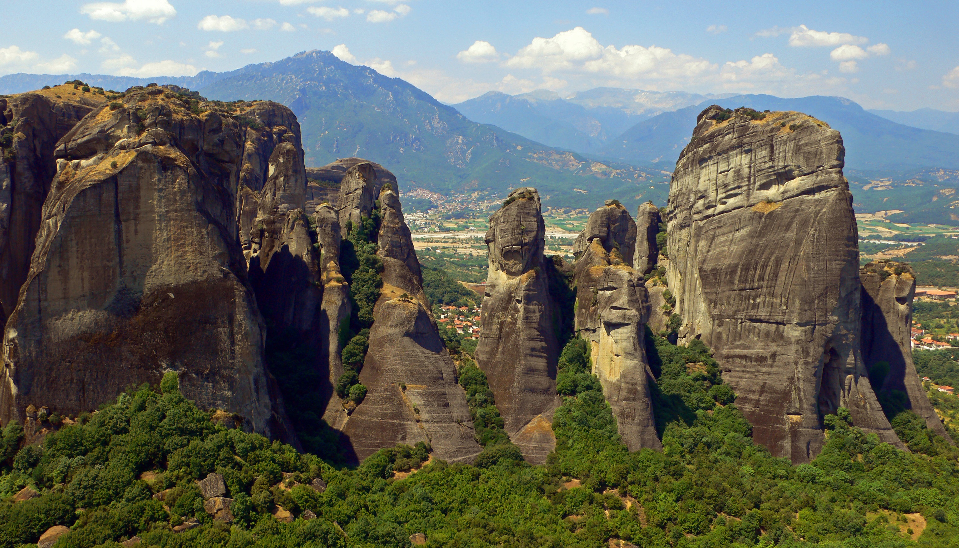 Meteora, Greece: Towering rock formations and mountains HD Wallpaper