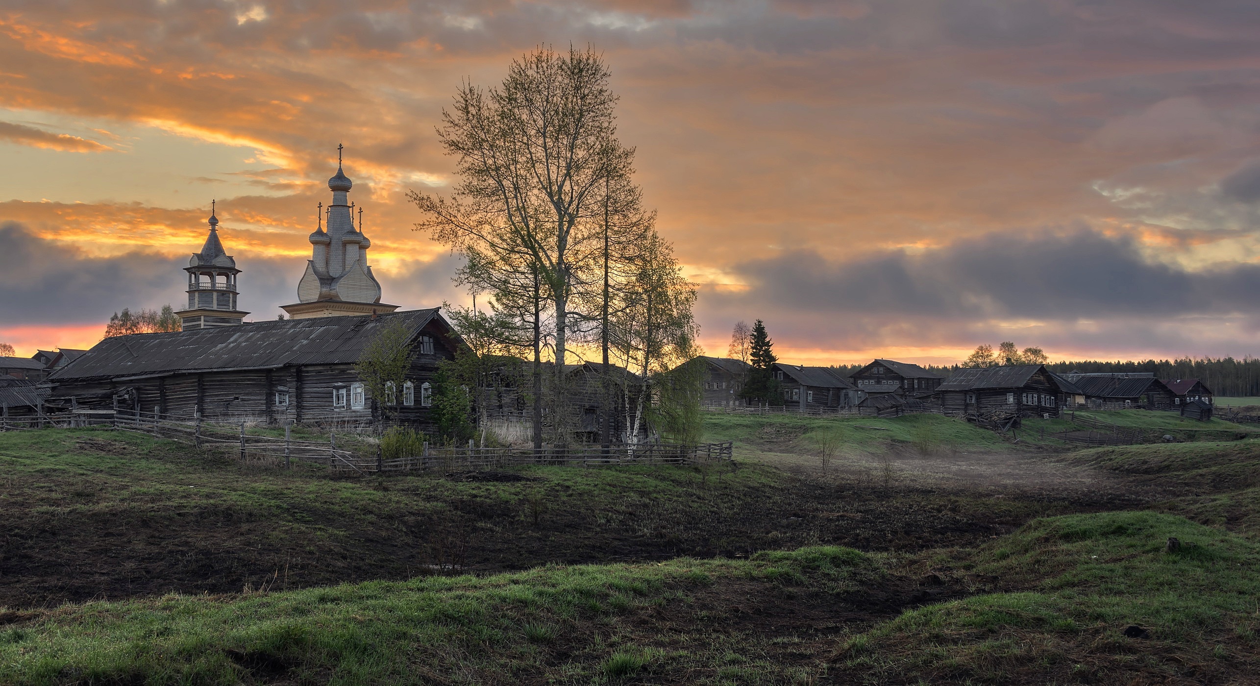 Village with church at sunrise in Arkhangelsk region, Russia HD Wallpaper