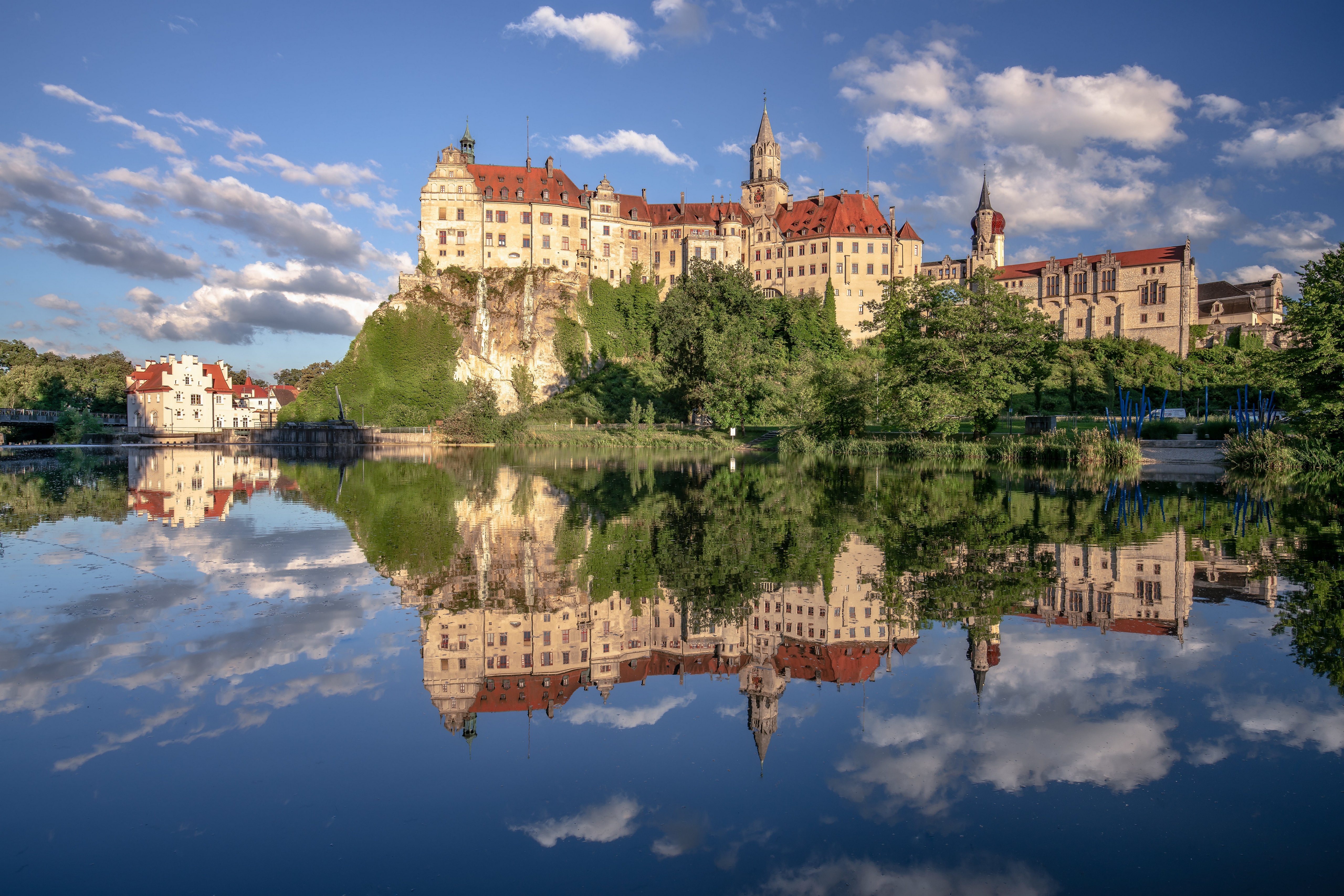 Sigmaringen Castle reflected in a pond under a cloudy sky HD Wallpaper