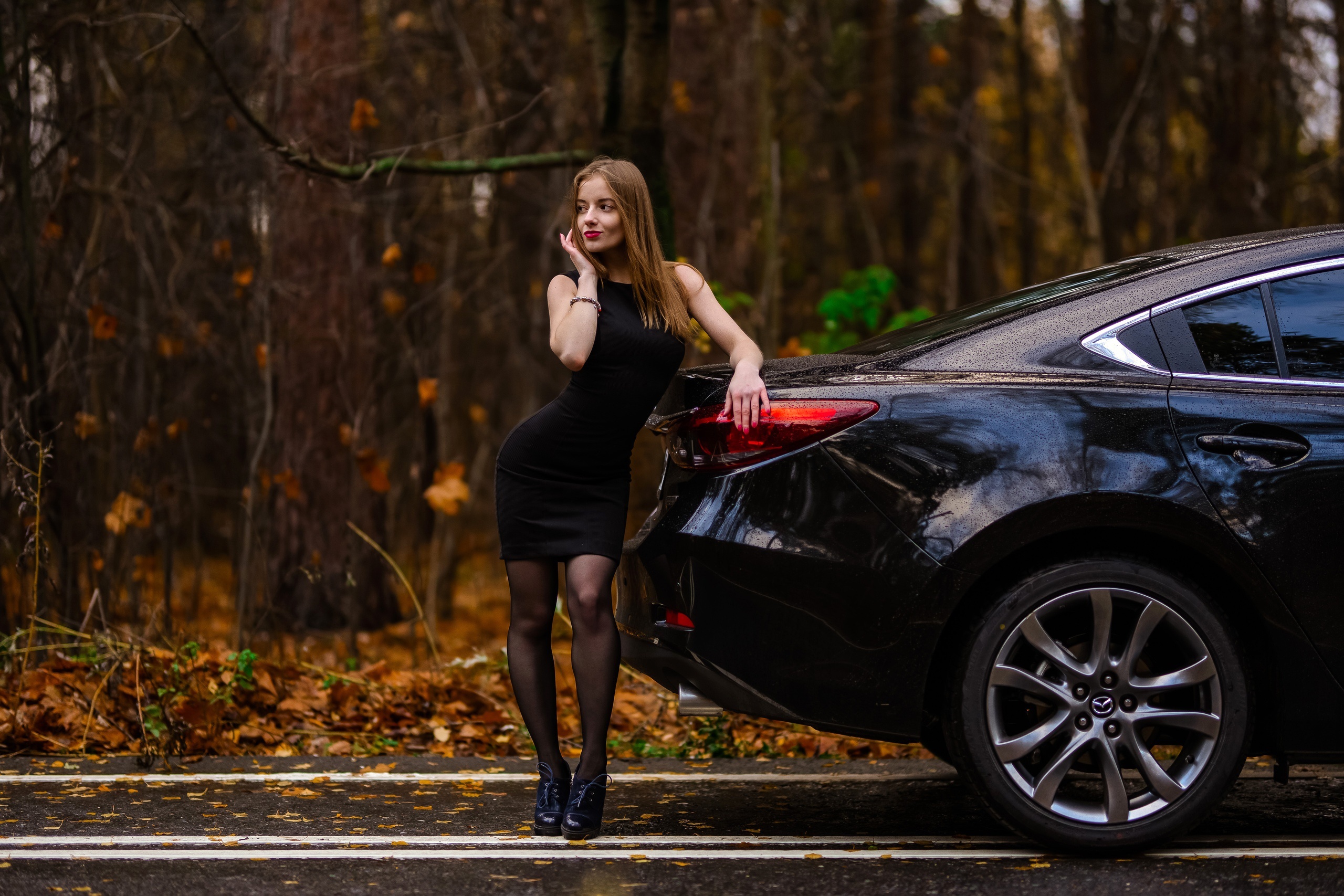 Woman in black dress leaning on a black car HD Wallpaper