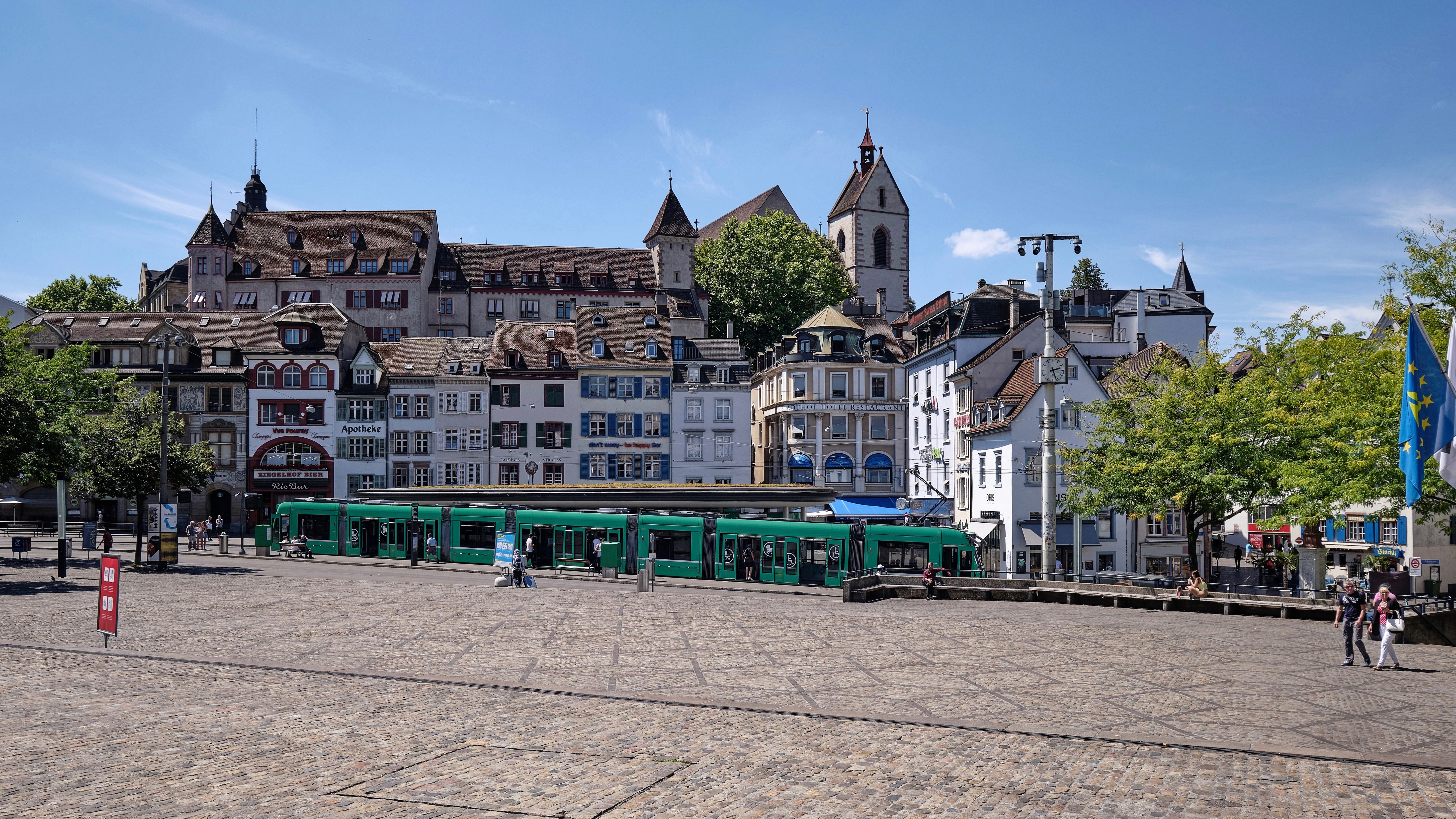Town square with tram in Switzerland HD Wallpaper