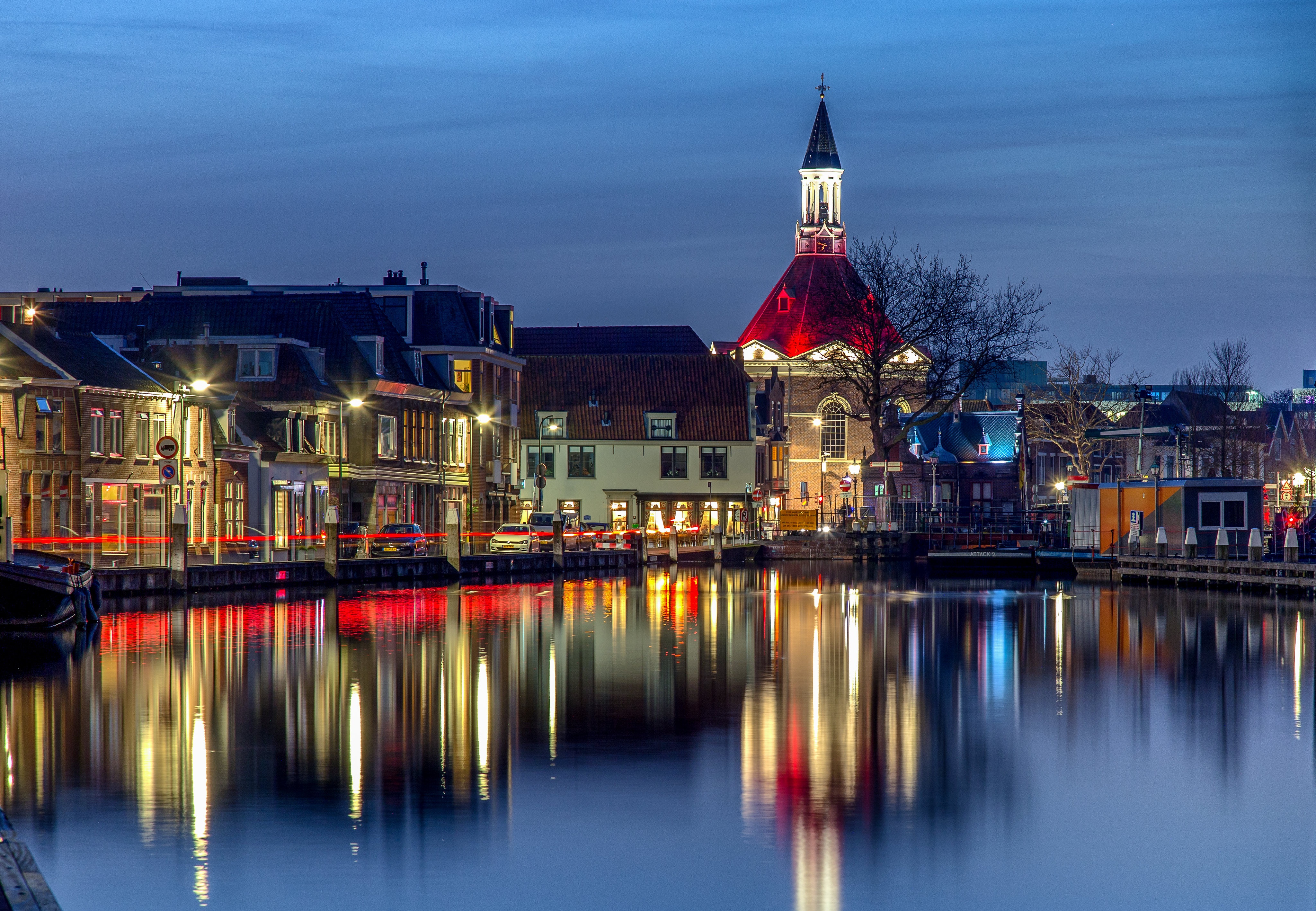 Houses and Church Reflected in Water at Night in Leidschendam HD Wallpaper