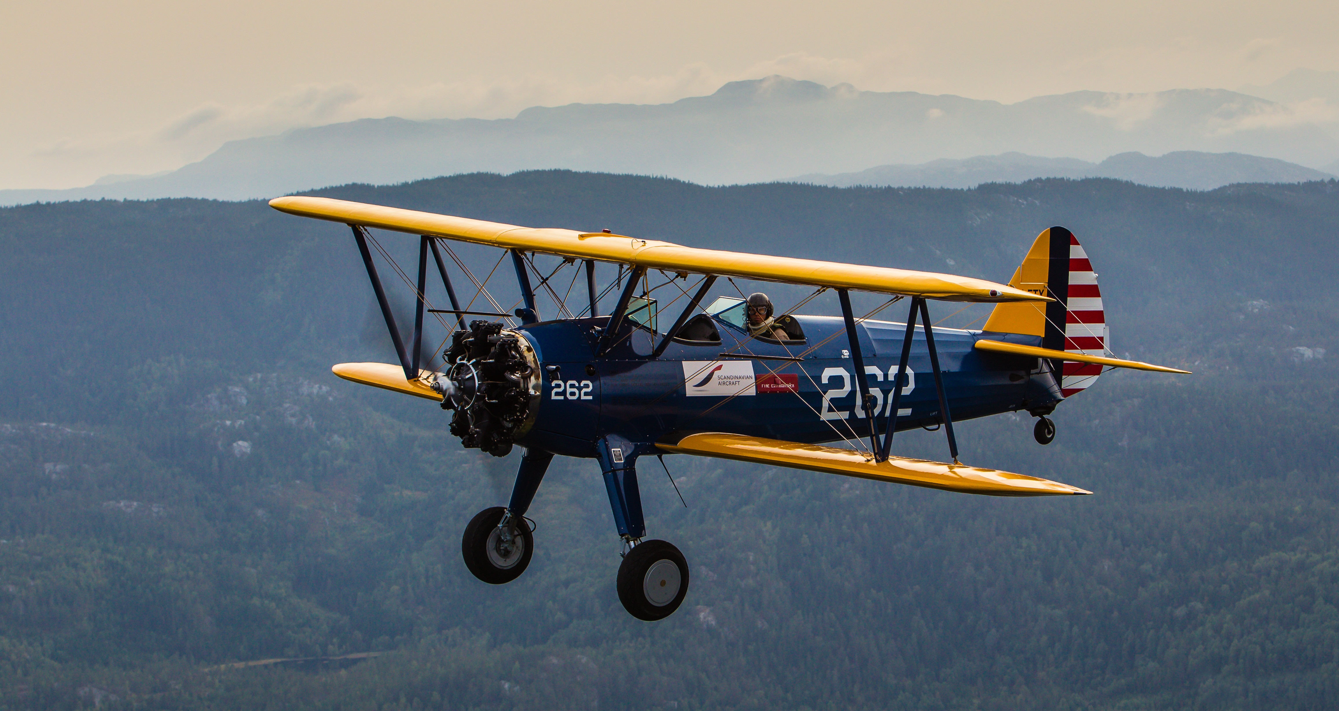 Boeing-Stearman PT-17 biplane in flight HD Wallpaper