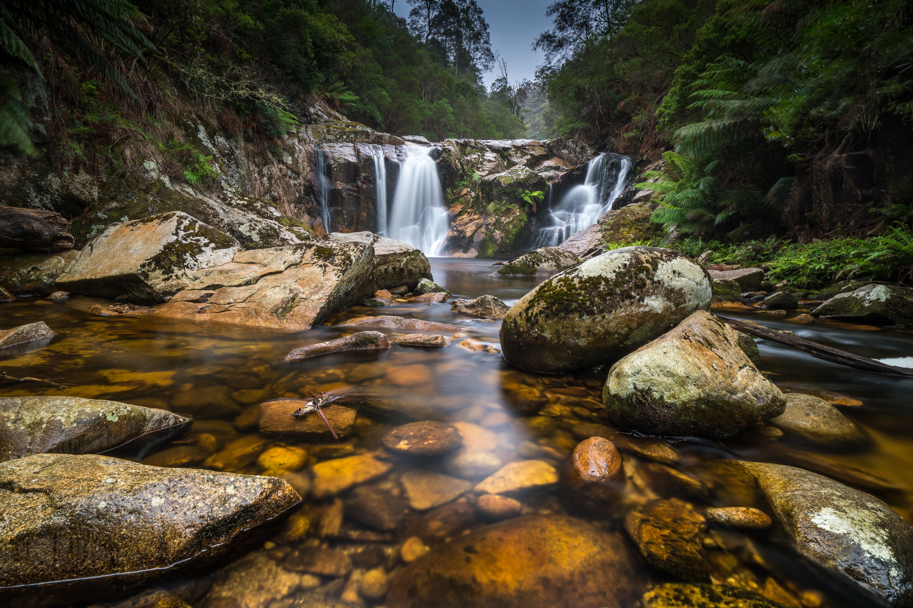 Waterfall flowing over rocks in Tasmania, Australia HD Wallpaper