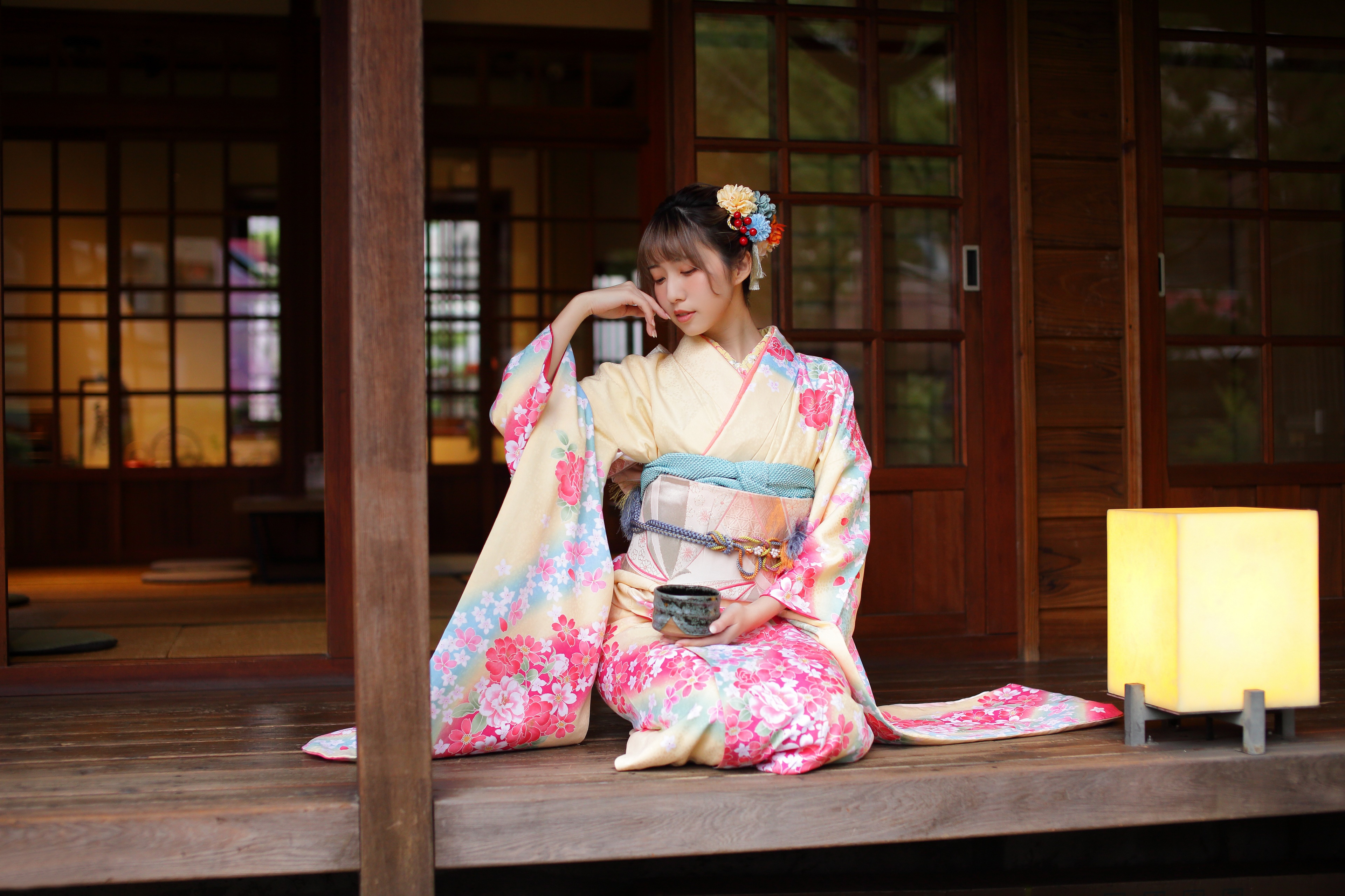 Asian woman in kimono sitting on a porch HD Wallpaper