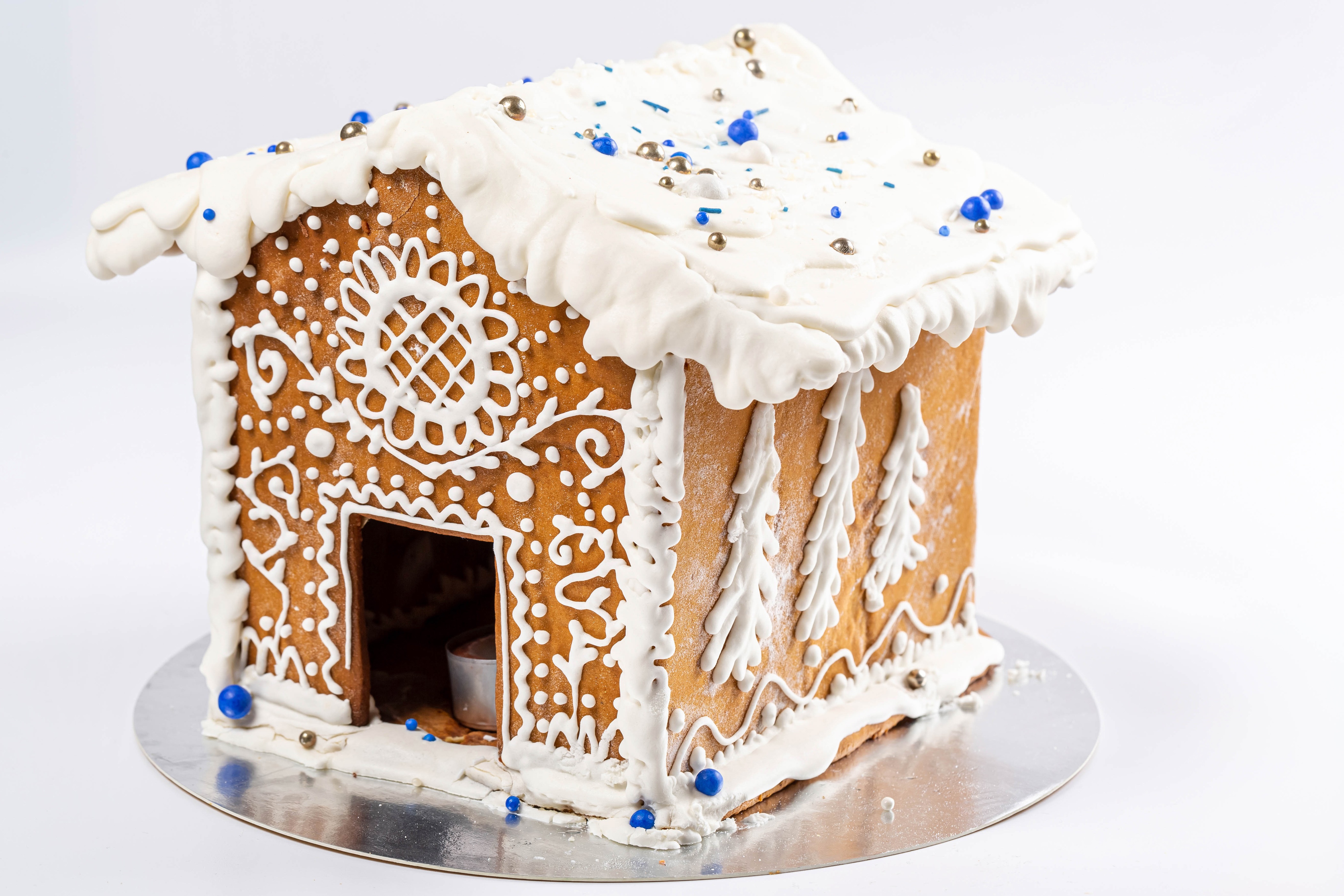 4K Gingerbread house with white icing and blue sprinkles HD Wallpaper