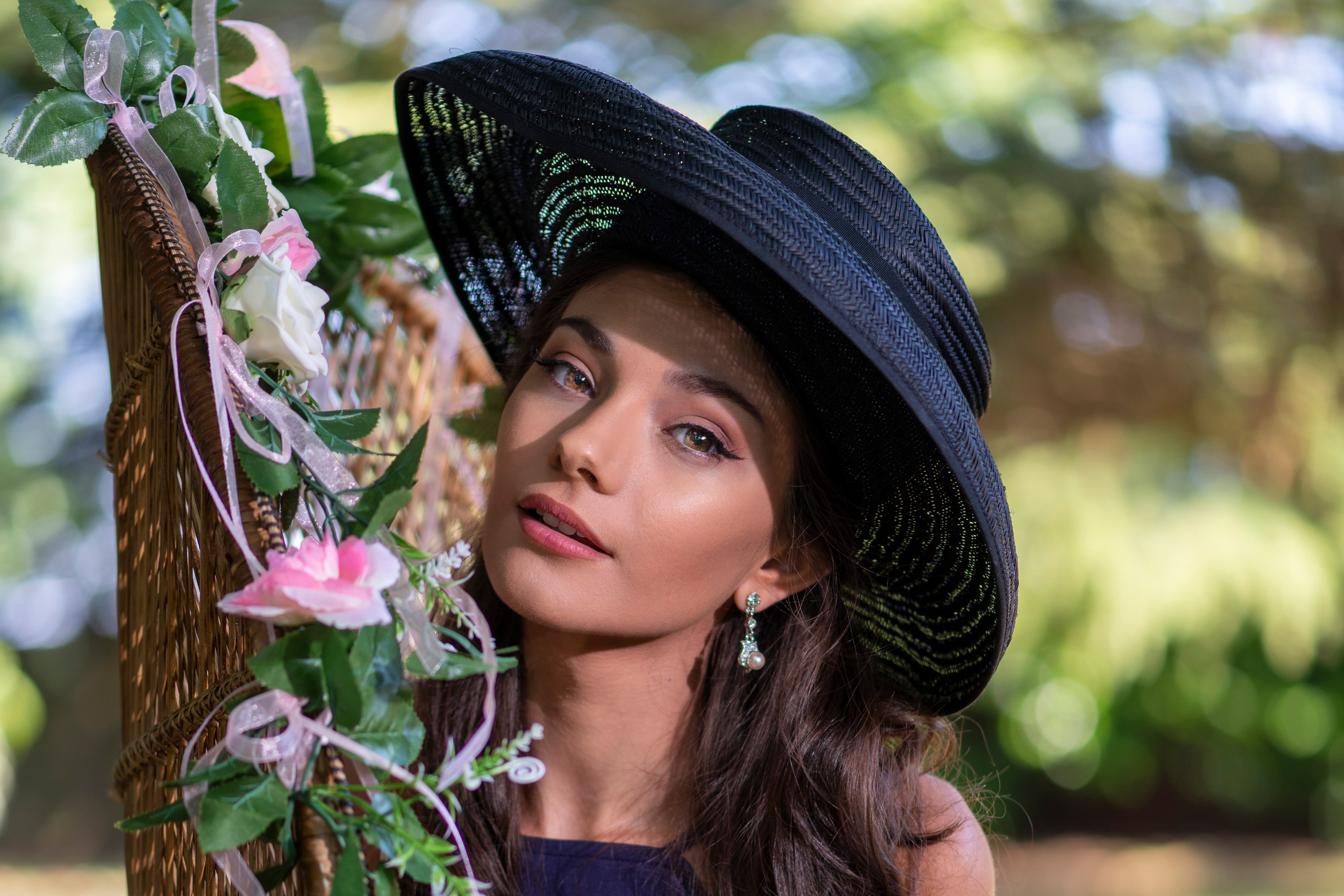 Woman in black hat with flowers HD Wallpaper