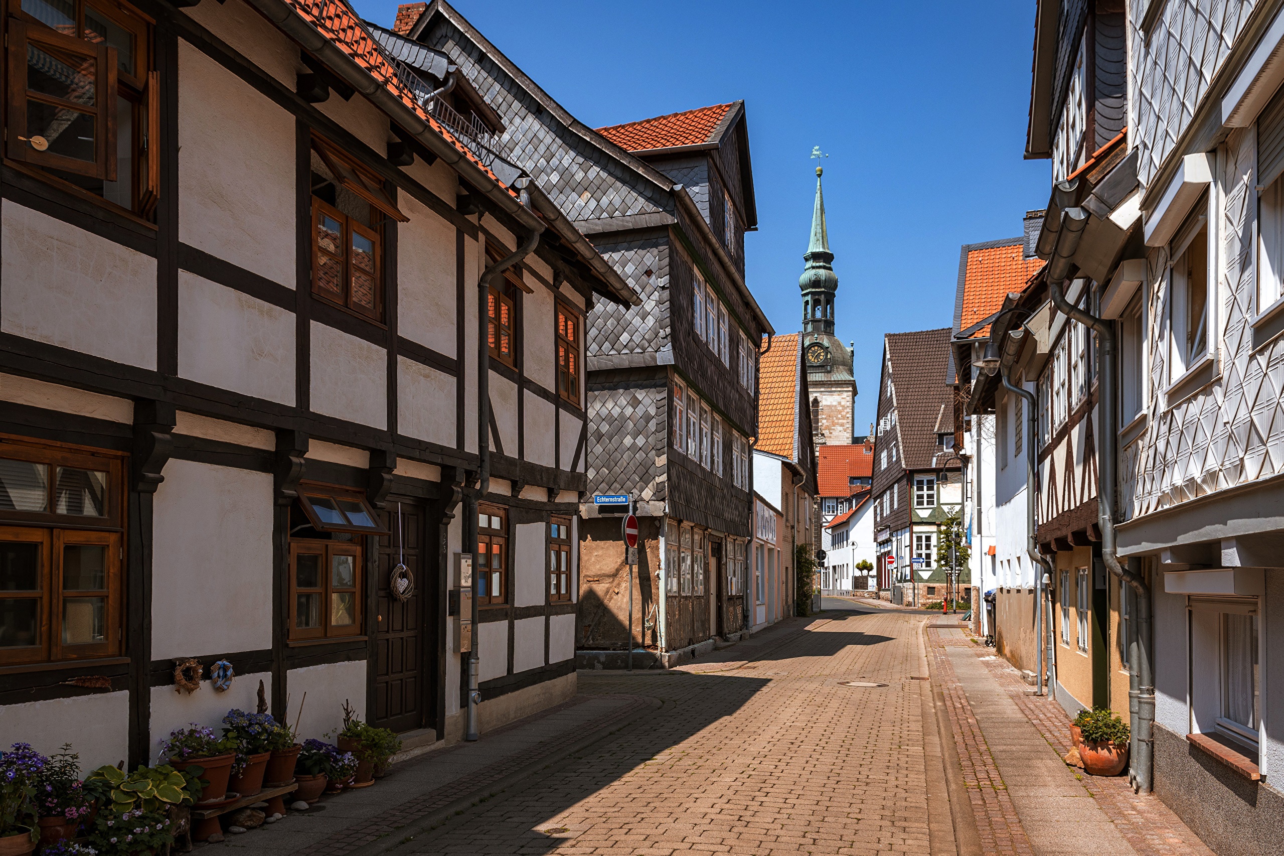 Half-timbered houses on a cobblestone street in Germany HD Wallpaper