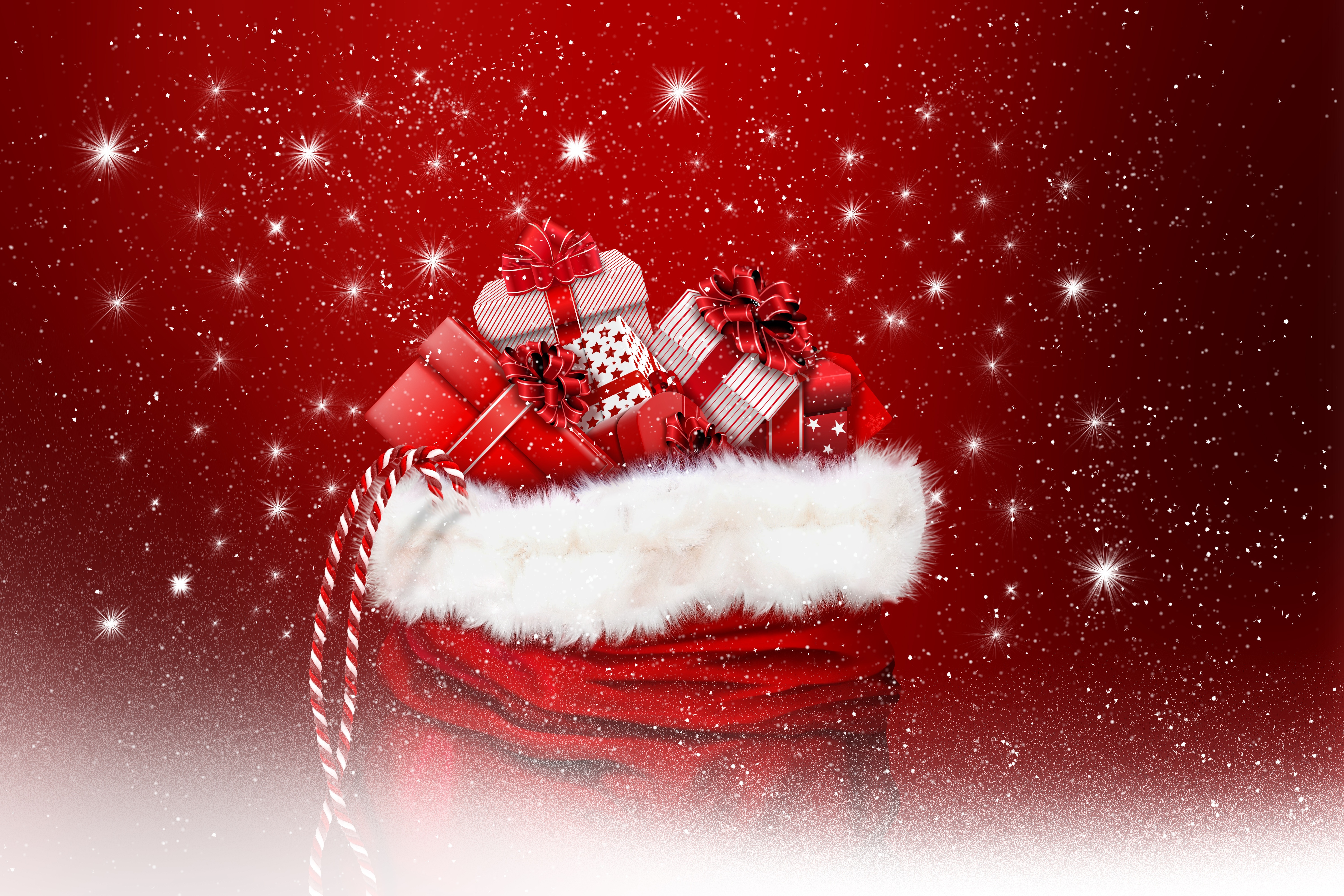 Christmas gifts in Santa's sack with red background HD Wallpaper