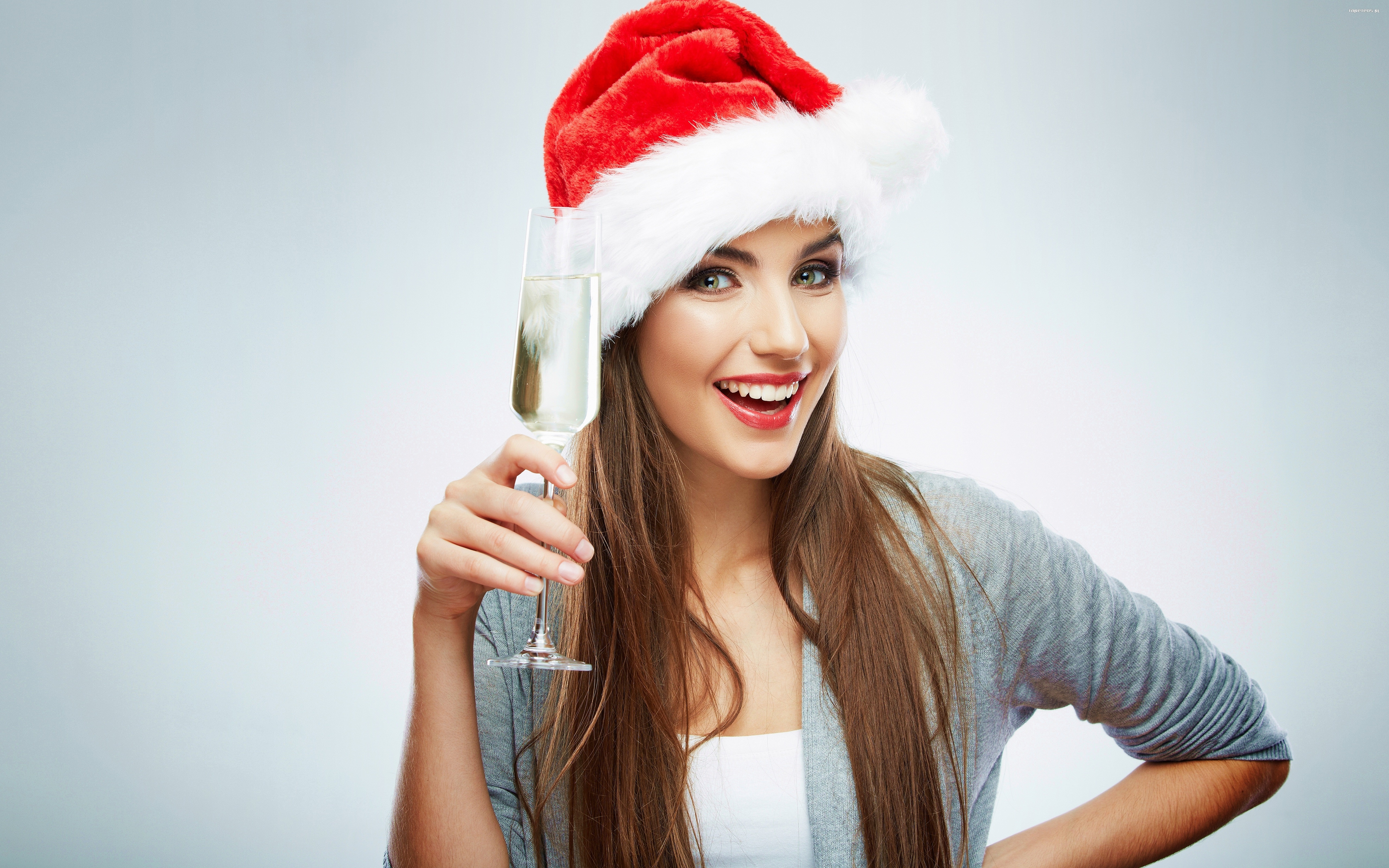 Woman in Santa hat holding champagne HD Wallpaper