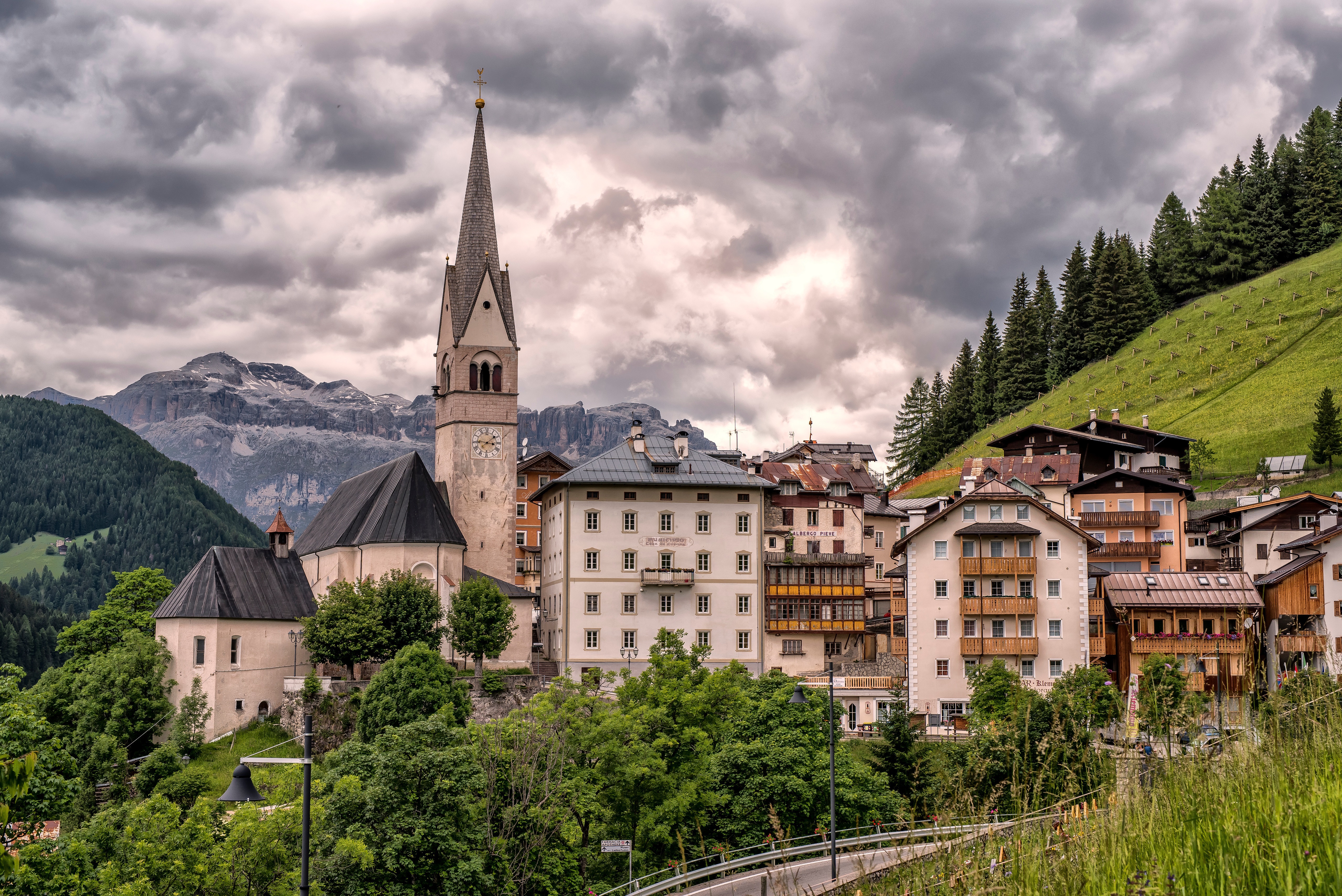 Church tower in a mountain village in the Dolomites, Italy HD Wallpaper