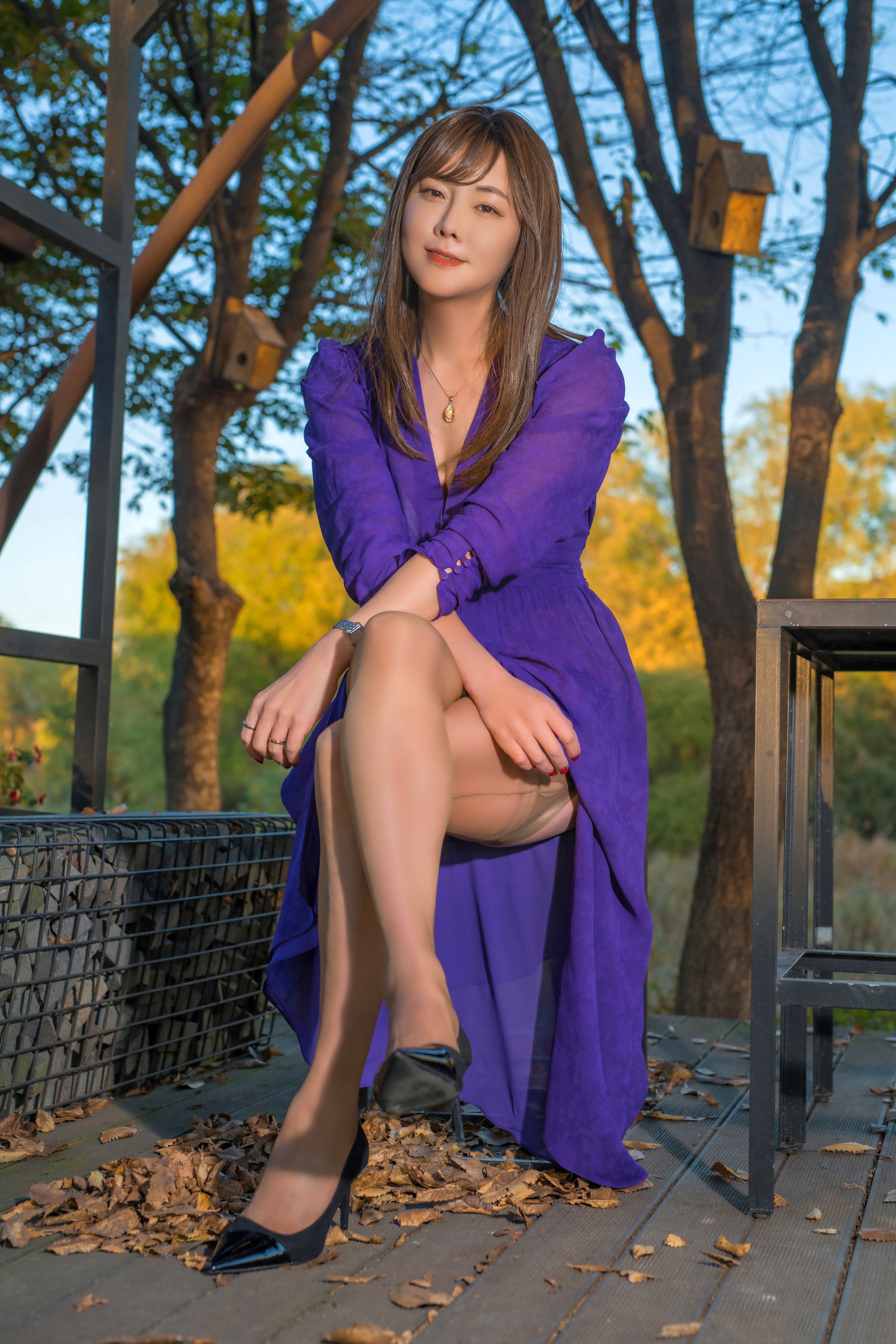 Woman in purple dress sitting outdoors HD Phone Wallpaper