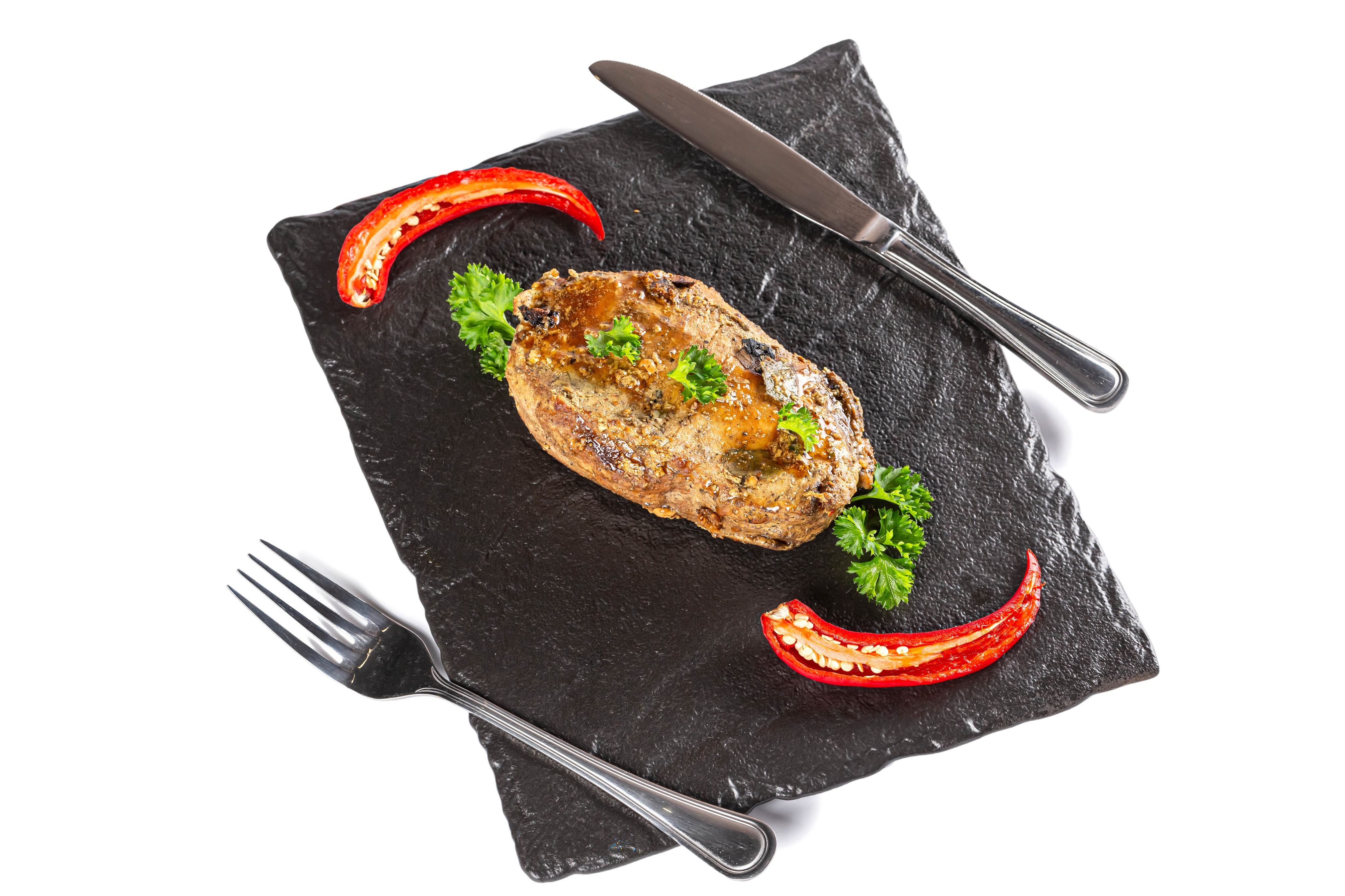 Meat with chili pepper on a cutting board with cutlery HD Wallpaper