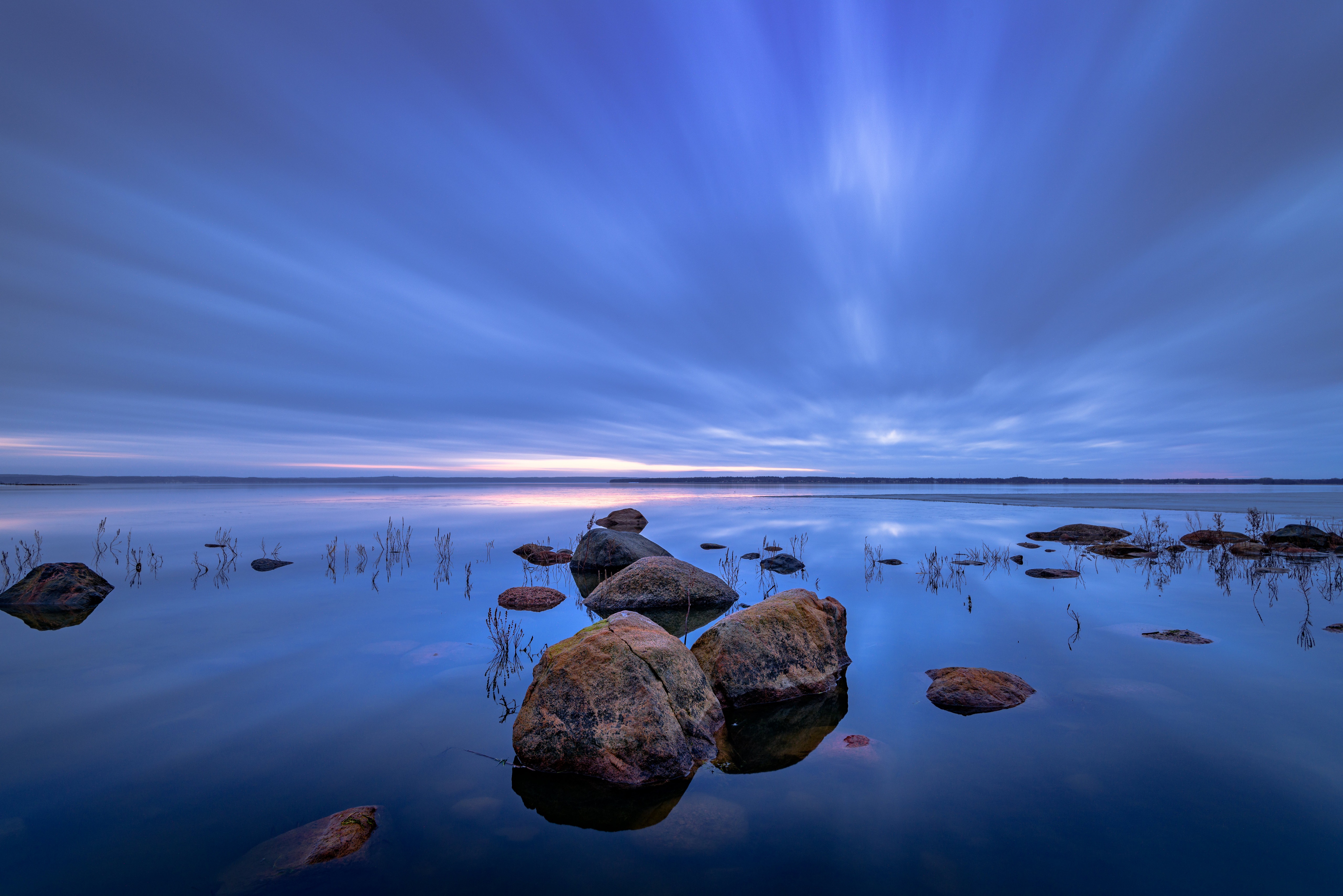 Stones in a lake at dusk, Sweden HD Wallpaper