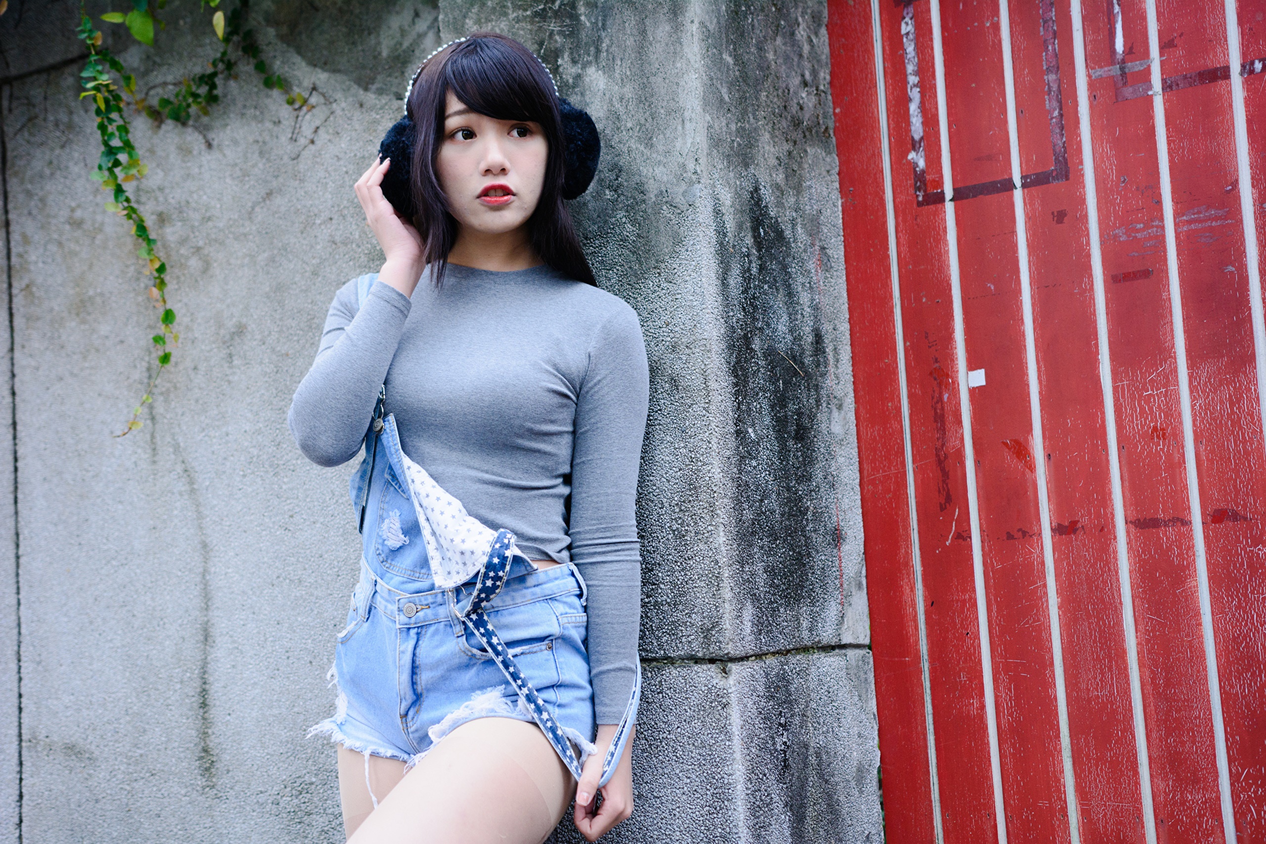 Asian girl with headphones and denim overalls HD Wallpaper