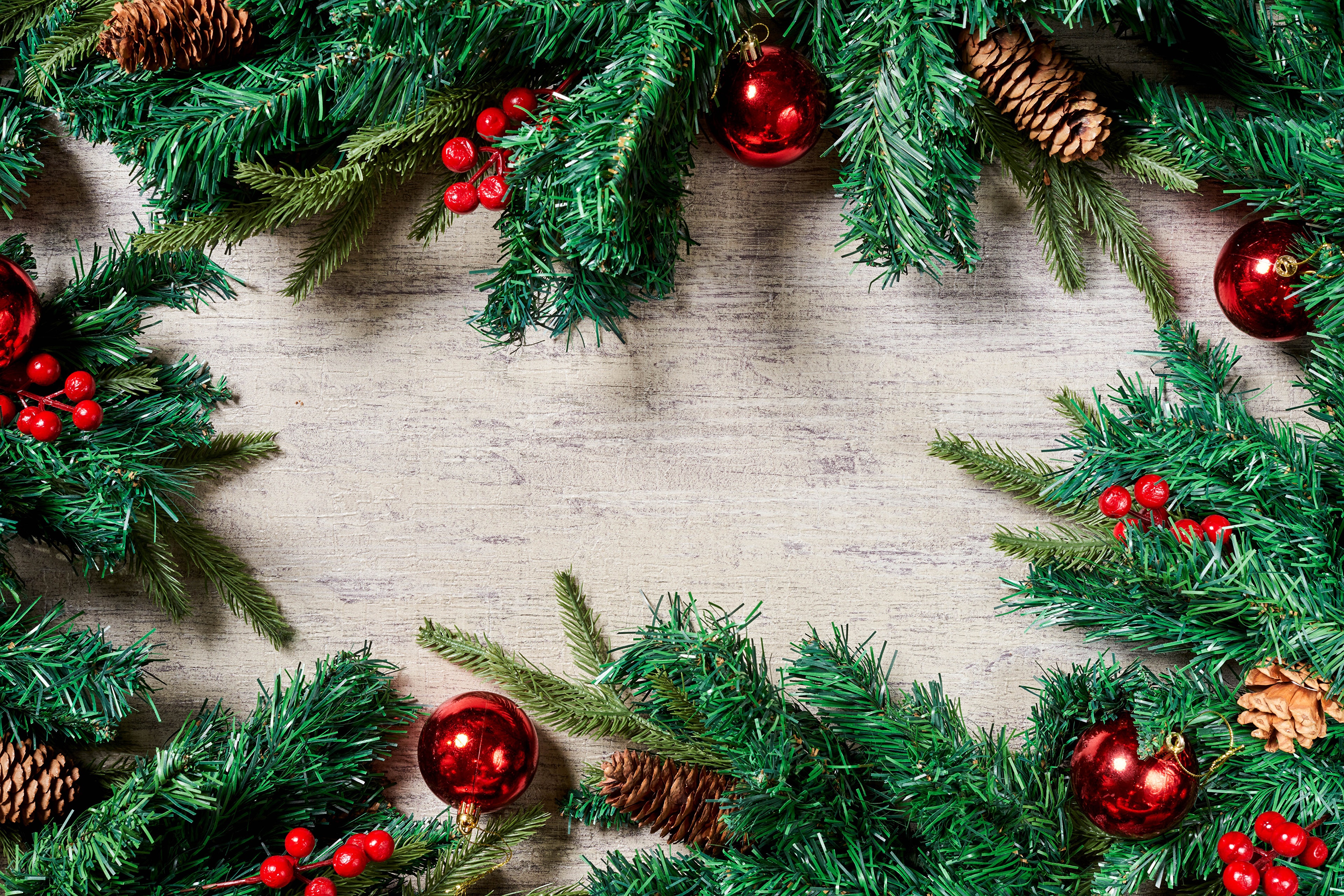 Christmas garland with pine cones and red berries HD Wallpaper