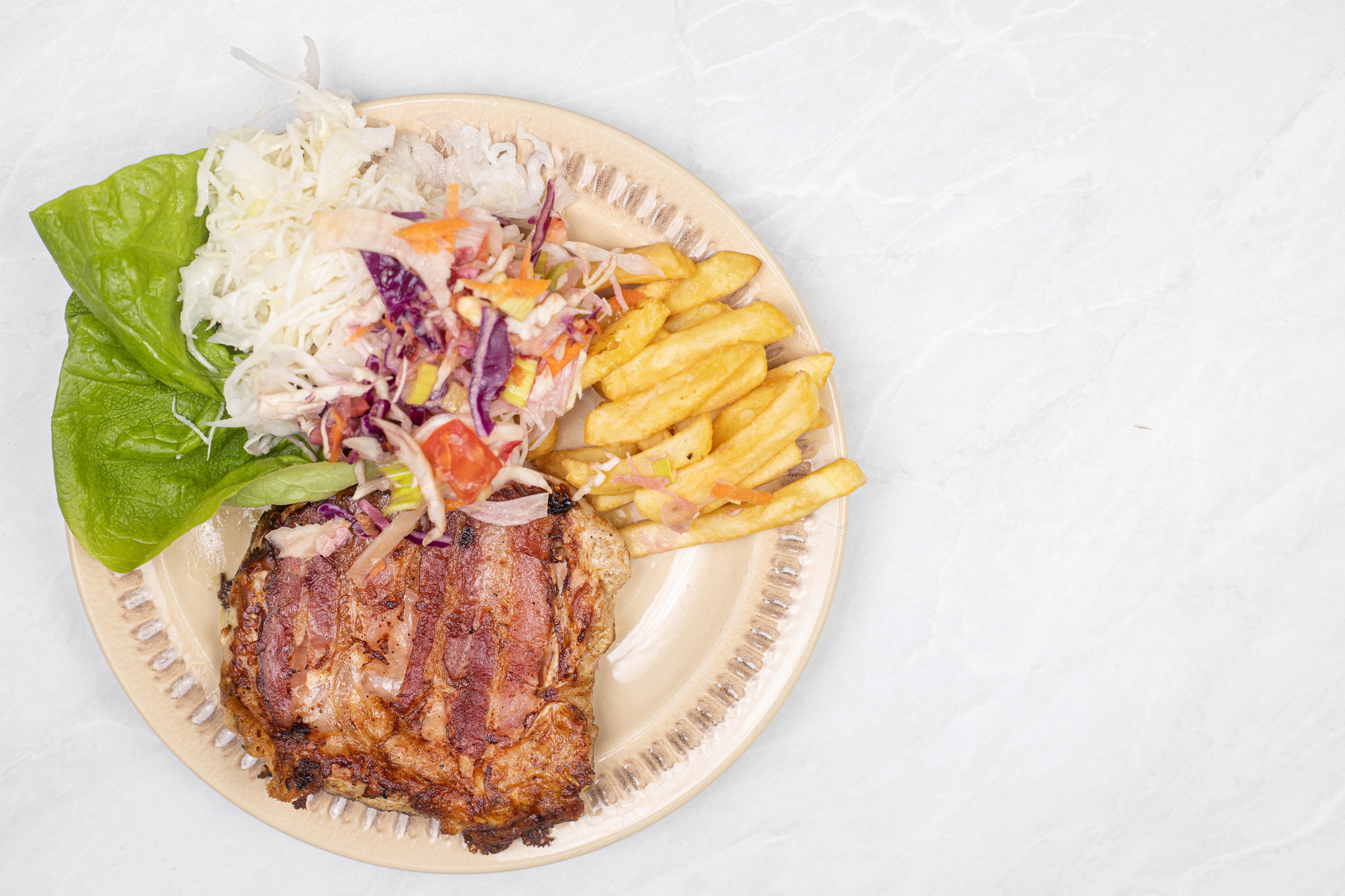 Pork ribs with french fries and coleslaw on a plate HD Wallpaper