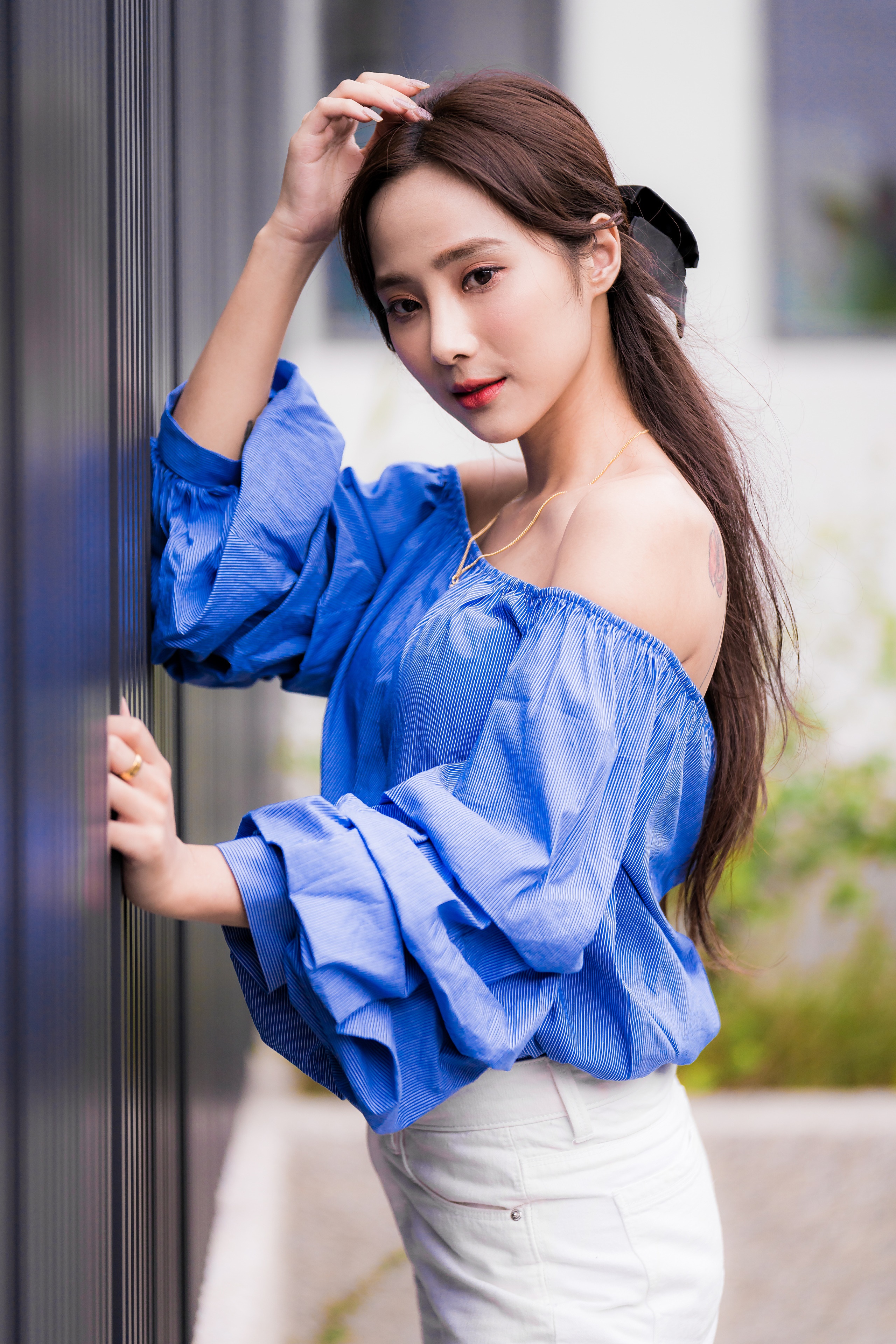 Asian woman with brown hair in blue off-the-shoulder blouse HD Phone Wallpaper