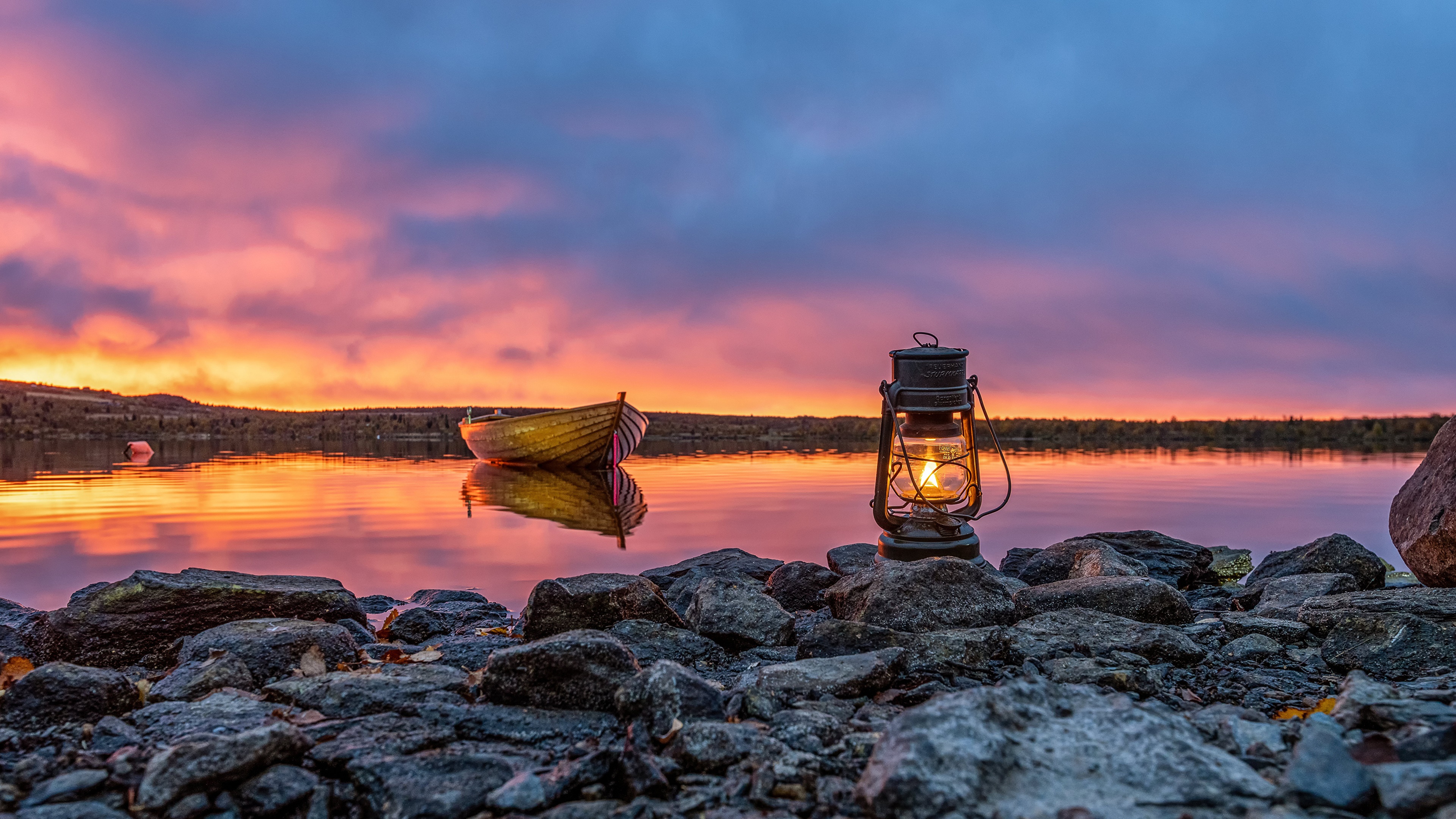 Boat and lantern by lake at sunset in Valdres, Norway HD Wallpaper