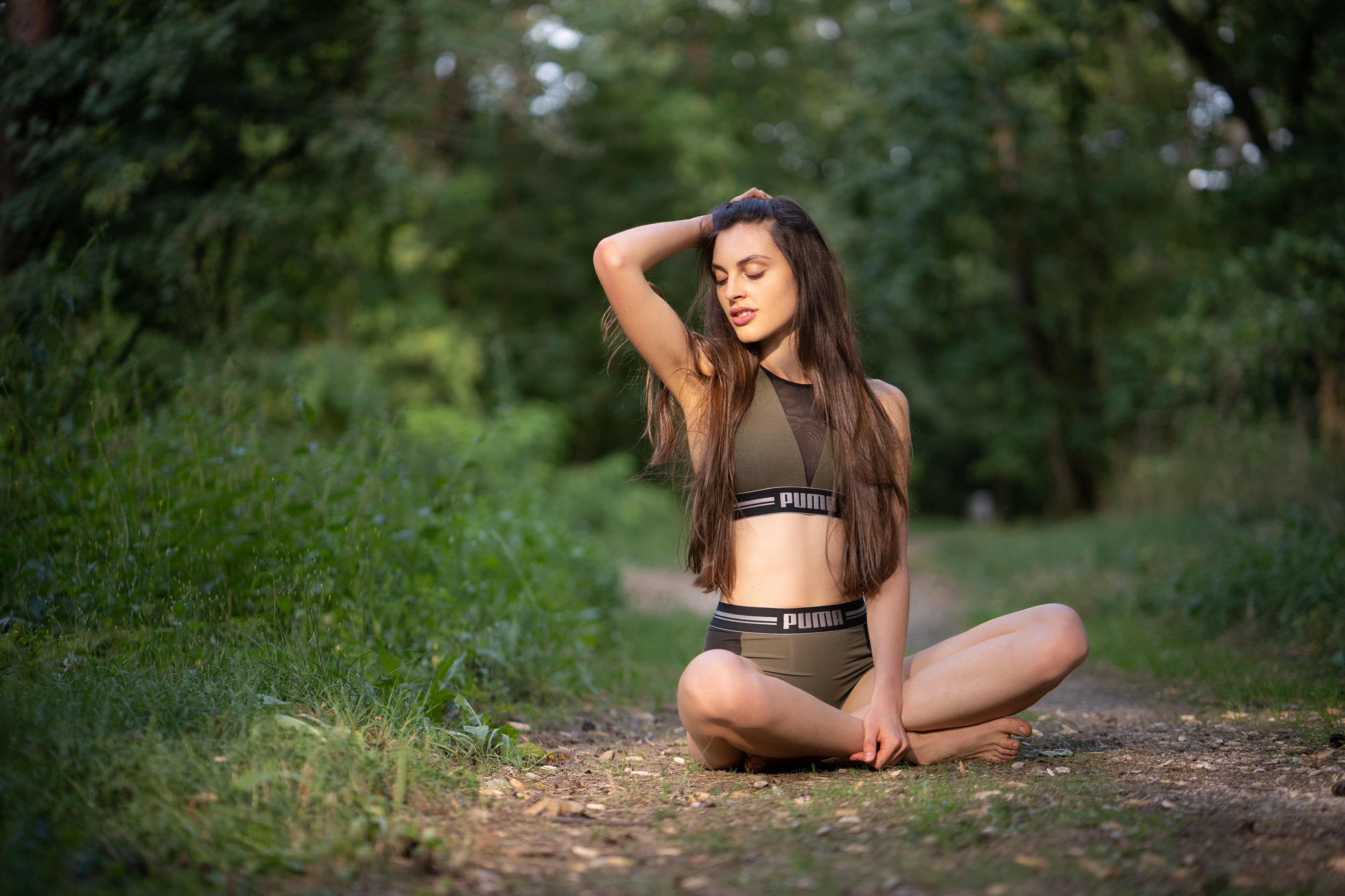Woman in Puma Sportswear Sitting in Forest HD Wallpaper