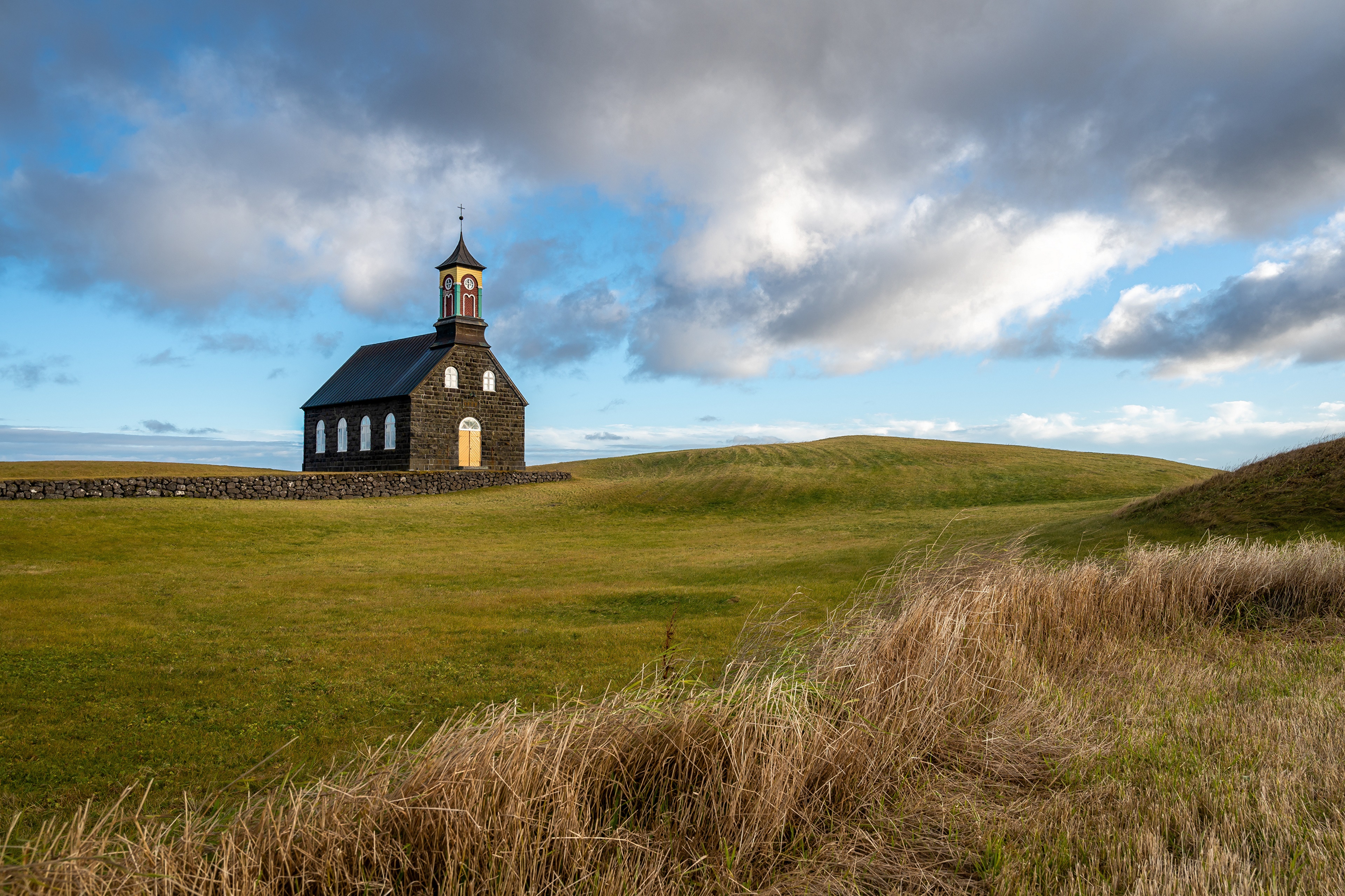 4K Hvalsneskirkja Iceland Church with Clouds HD Wallpaper