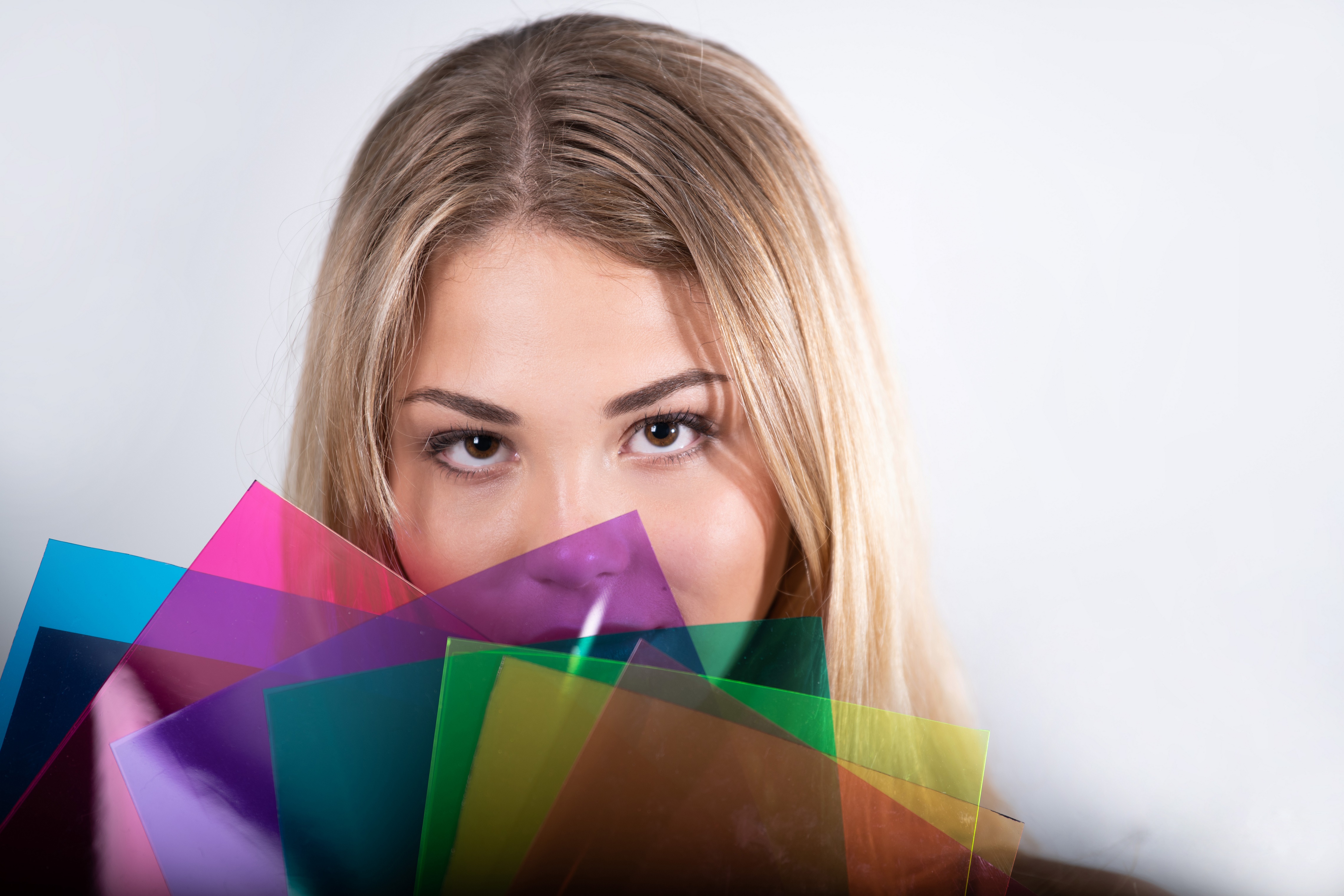 Blonde girl with colorful translucent sheets HD Wallpaper