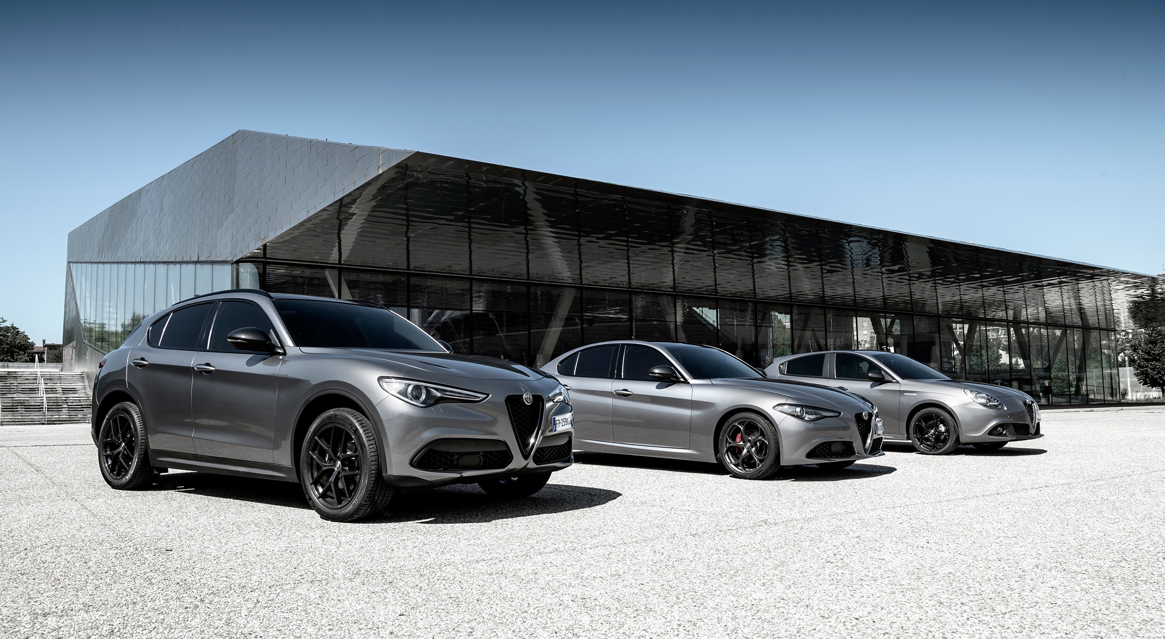 Three Grey Alfa Romeo Cars in front of a Modern Building HD Wallpaper