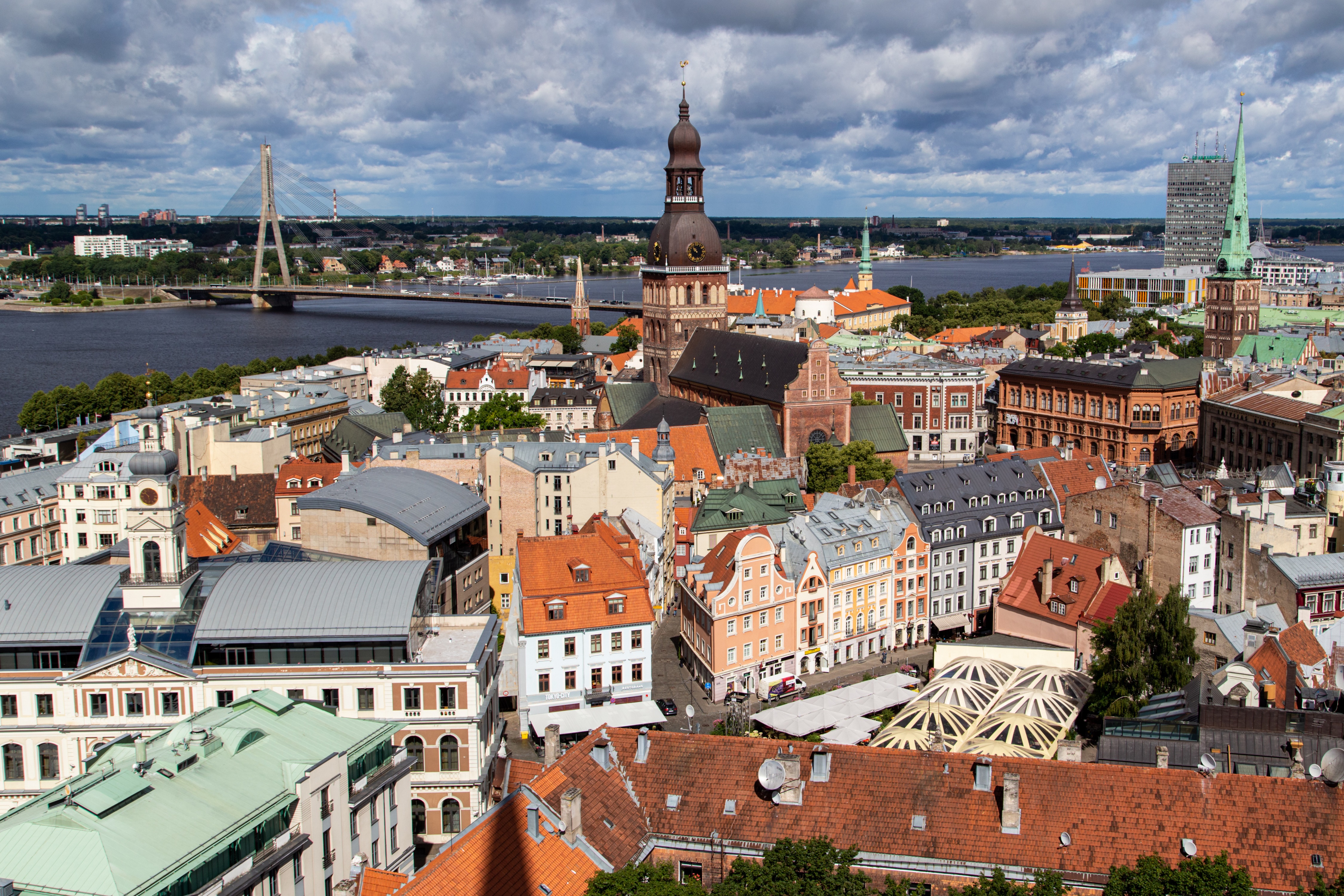 Riga, Latvia cityscape with river and bridge HD Wallpaper