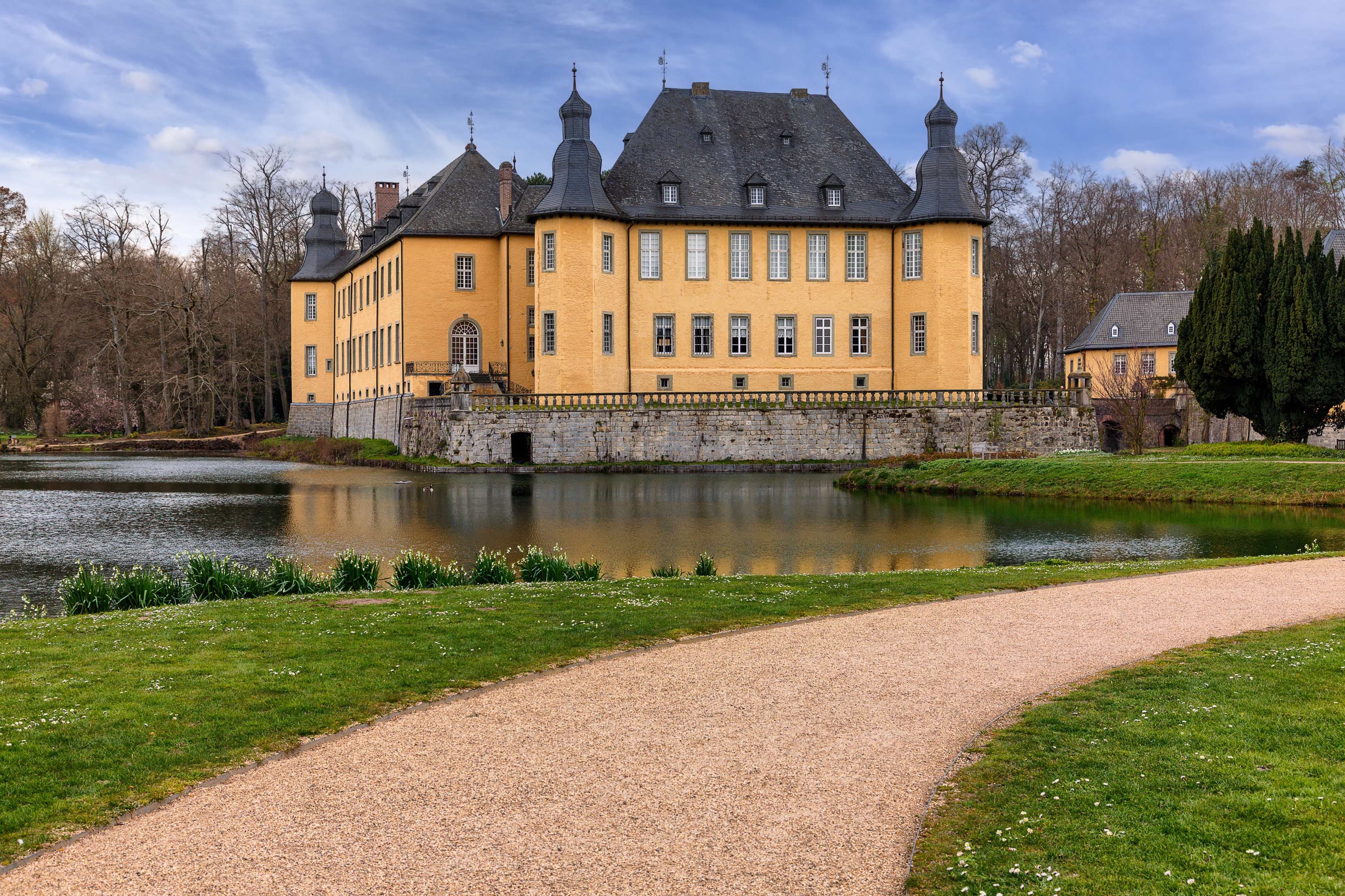 Yellow castle with towers on a pond in Germany HD Wallpaper
