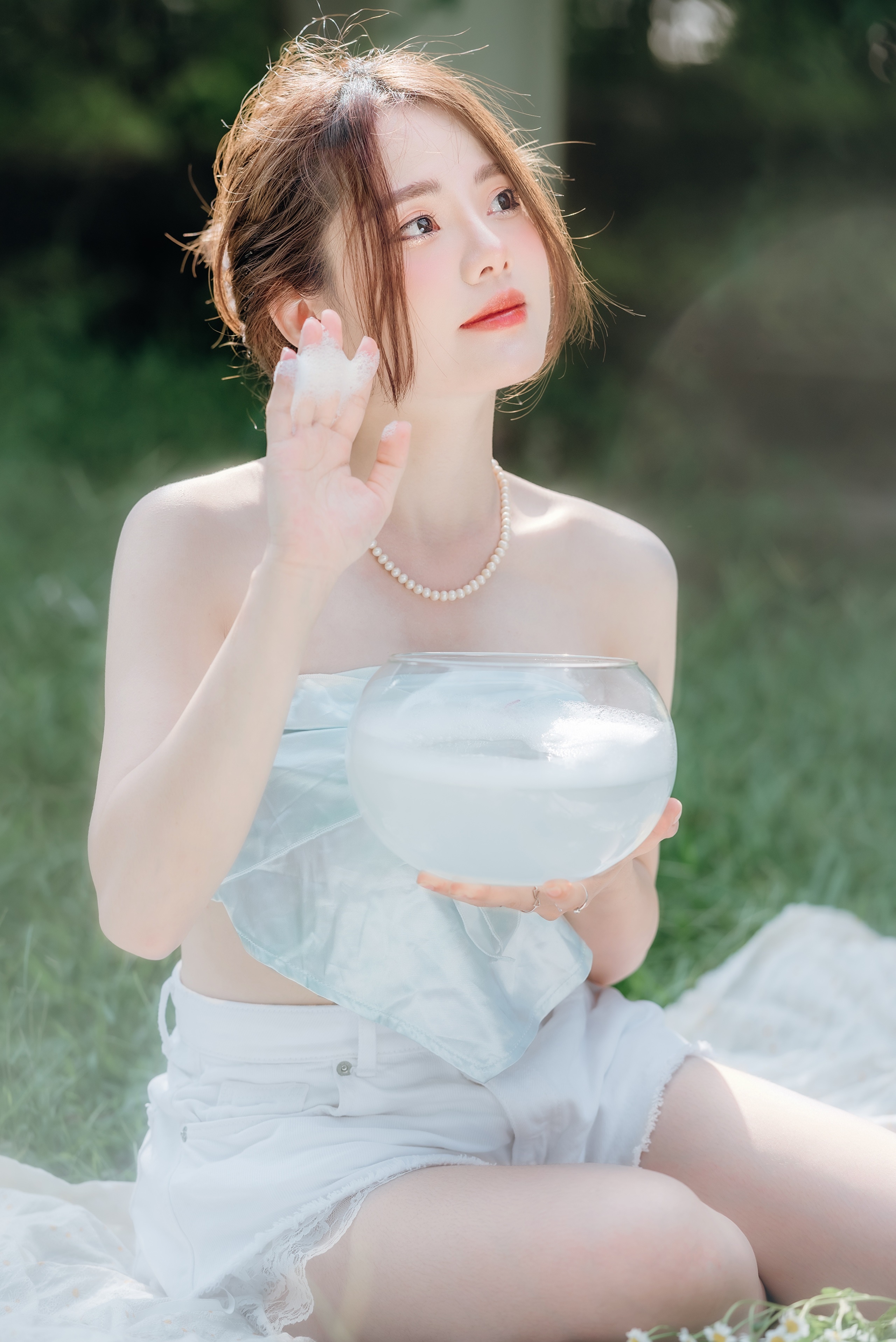 Asian woman with brown hair holding a glass bowl HD Phone Wallpaper