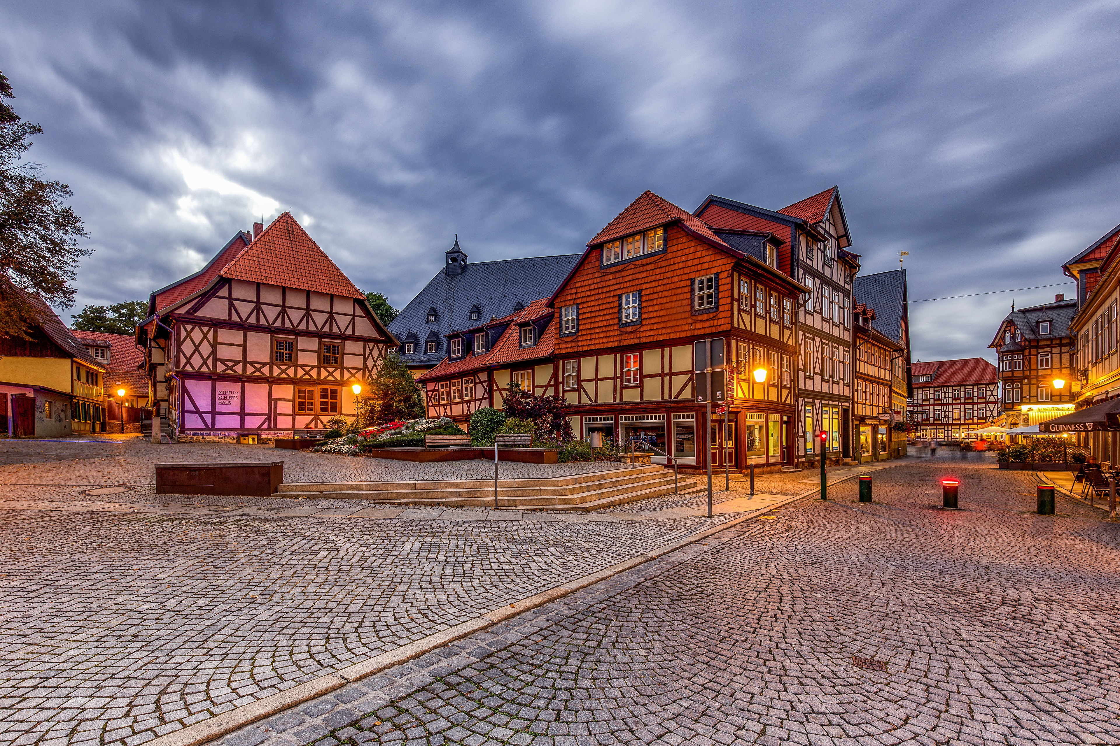 Wernigerode half-timbered houses and cobblestone street at dusk HD Wallpaper